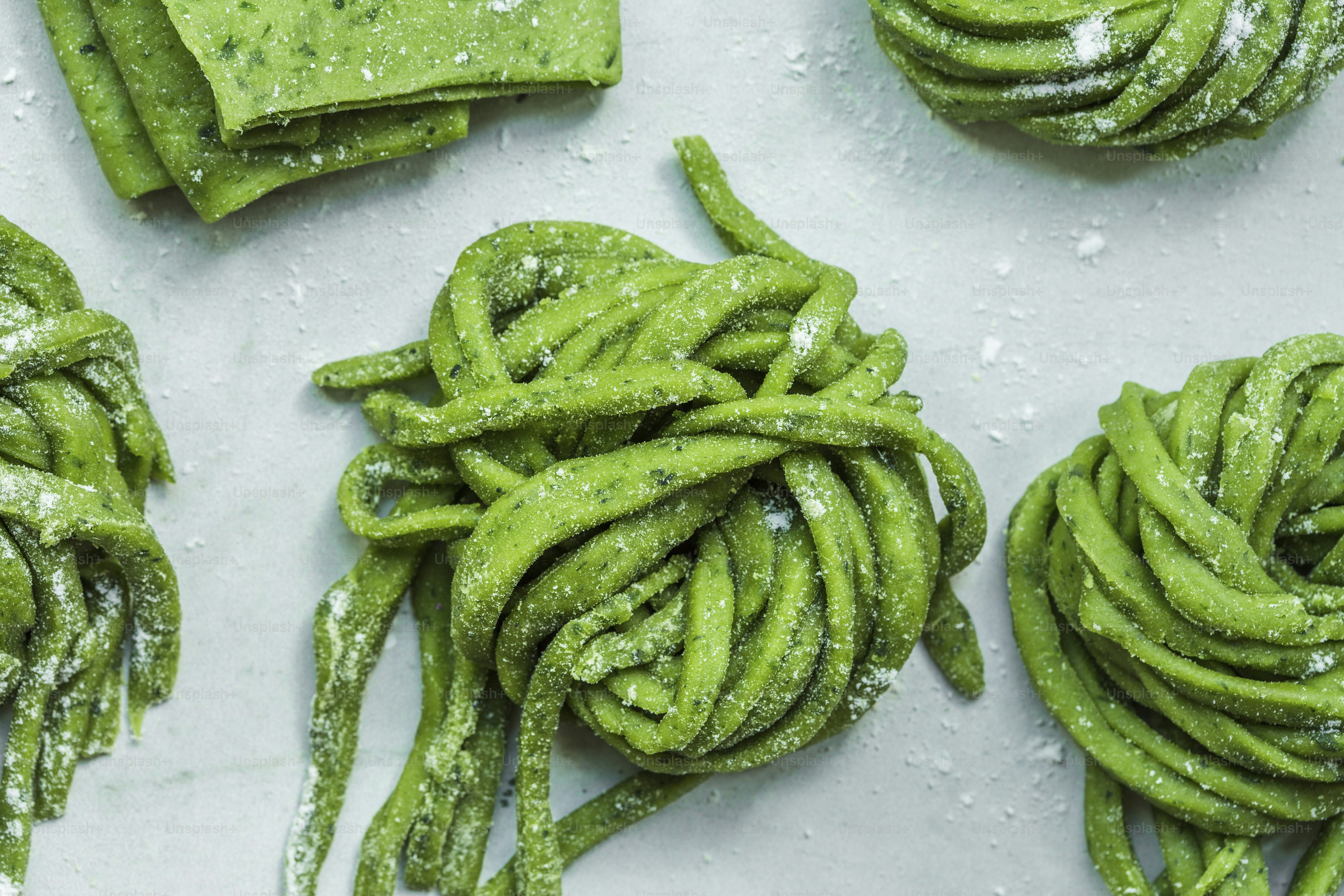 A bunch of green food that is on a table