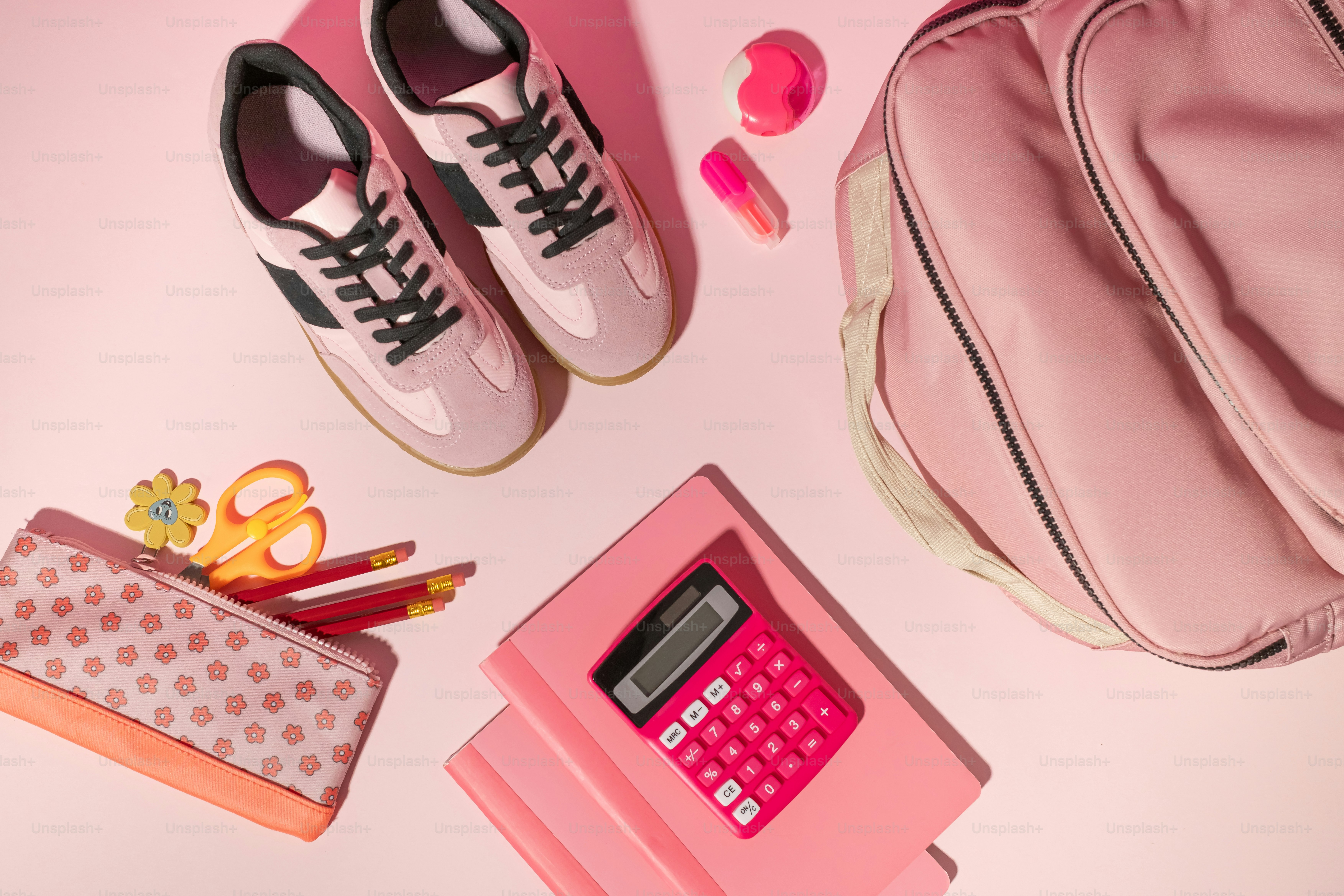 A pink bag, a pink wallet, a pink purse, and a pair of