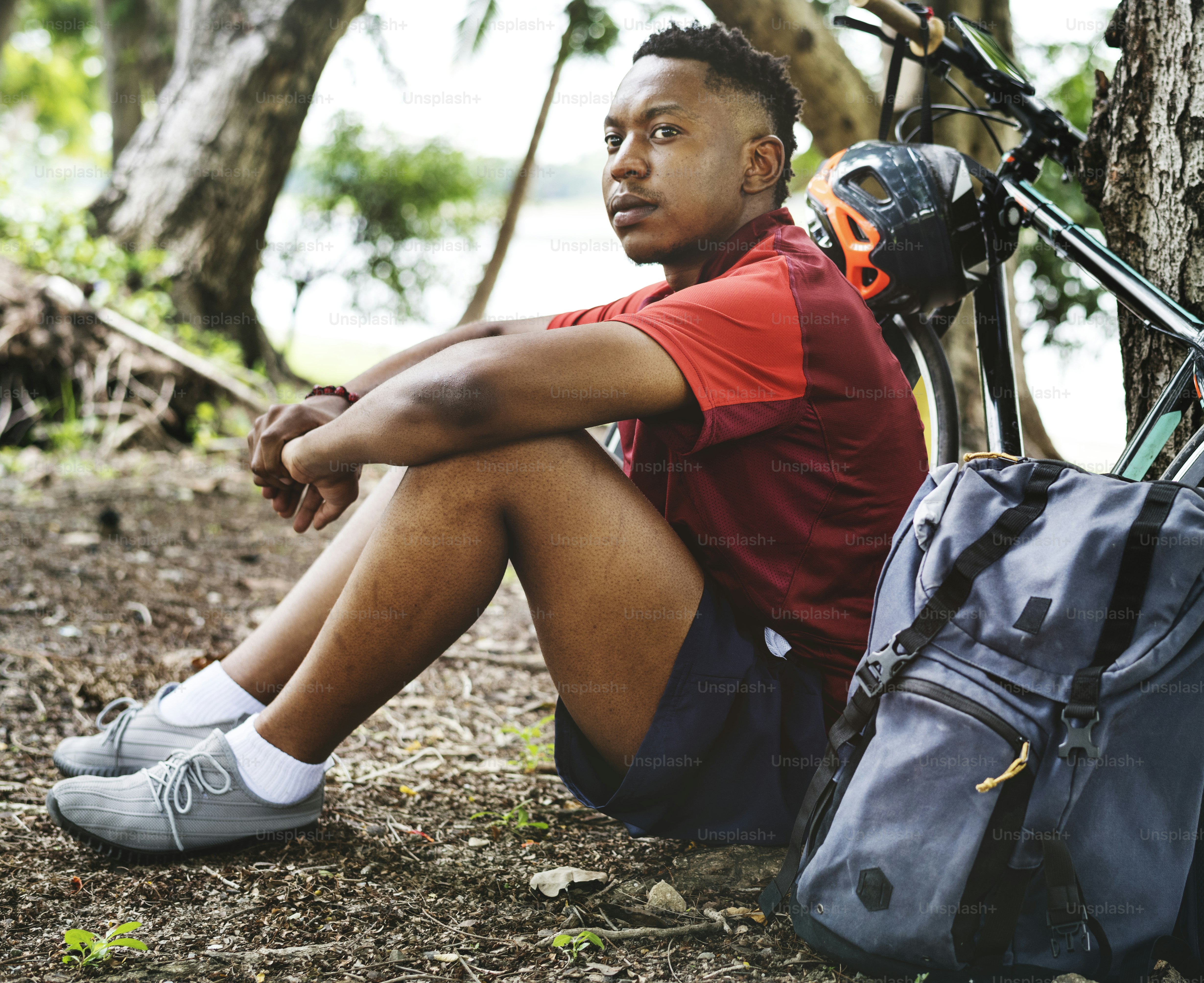 Cyclist sitting by his bike