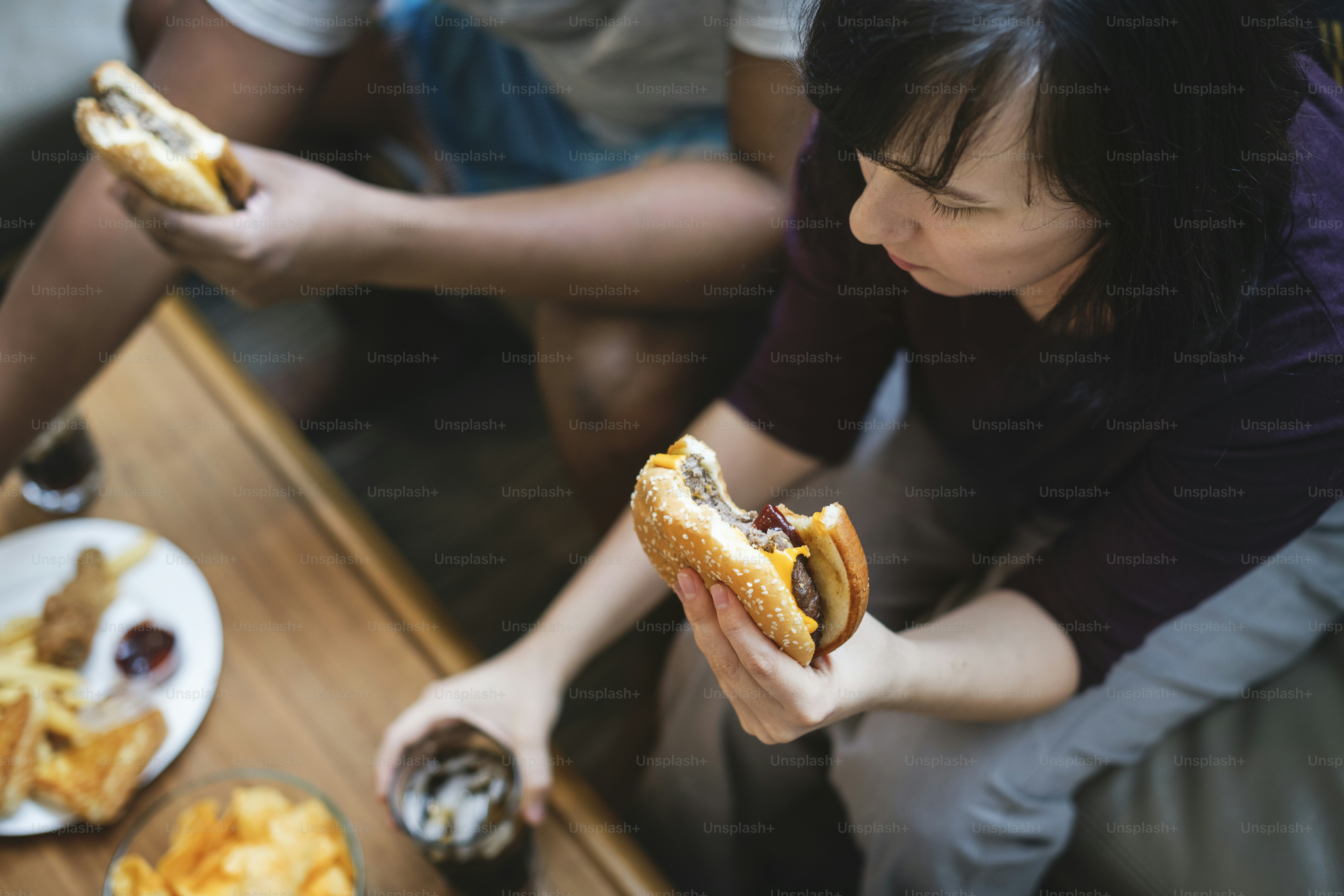 Couple having fast food on the couch
