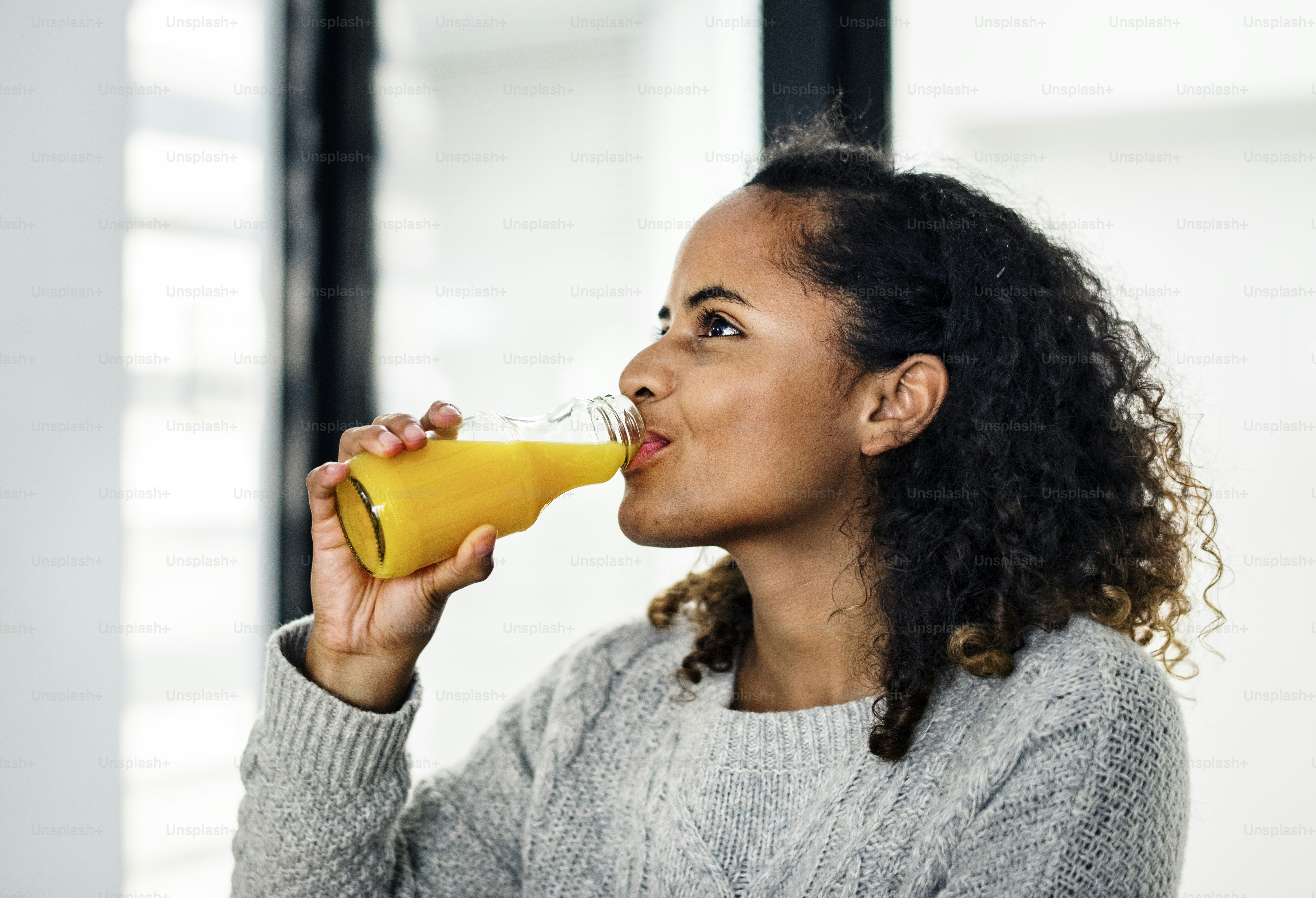 Woman drinking fresh orange juice