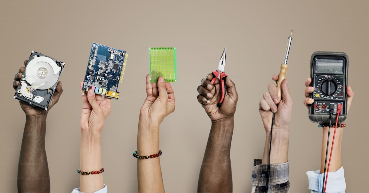 Group of hands holding computer electronics parts isolated on white ...