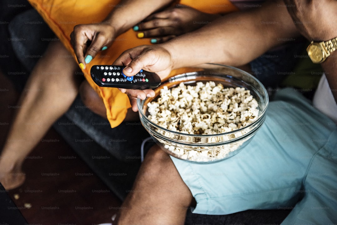 Closeup of popcorn bolw on a lap