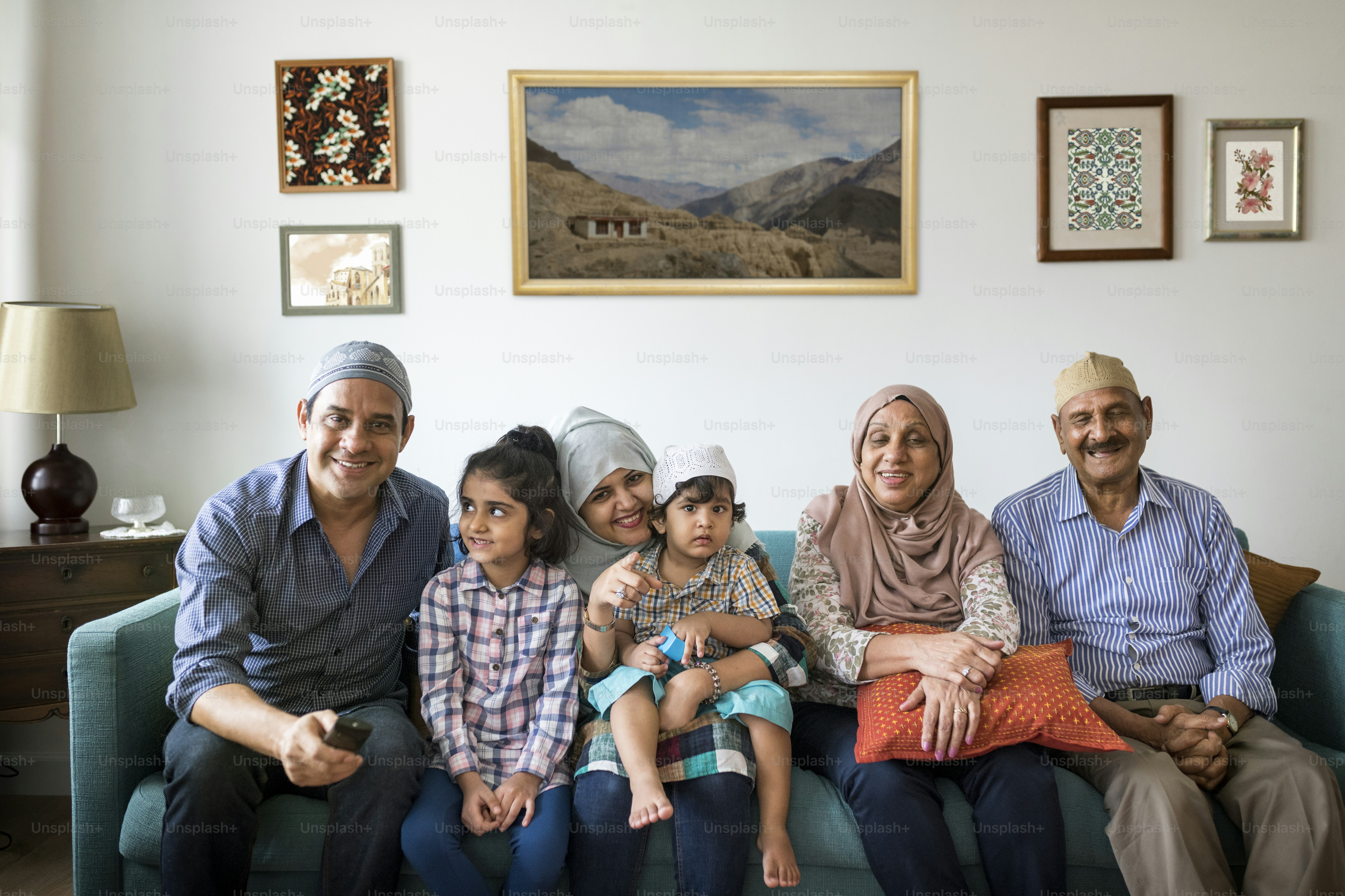 Muslim family relaxing in the home