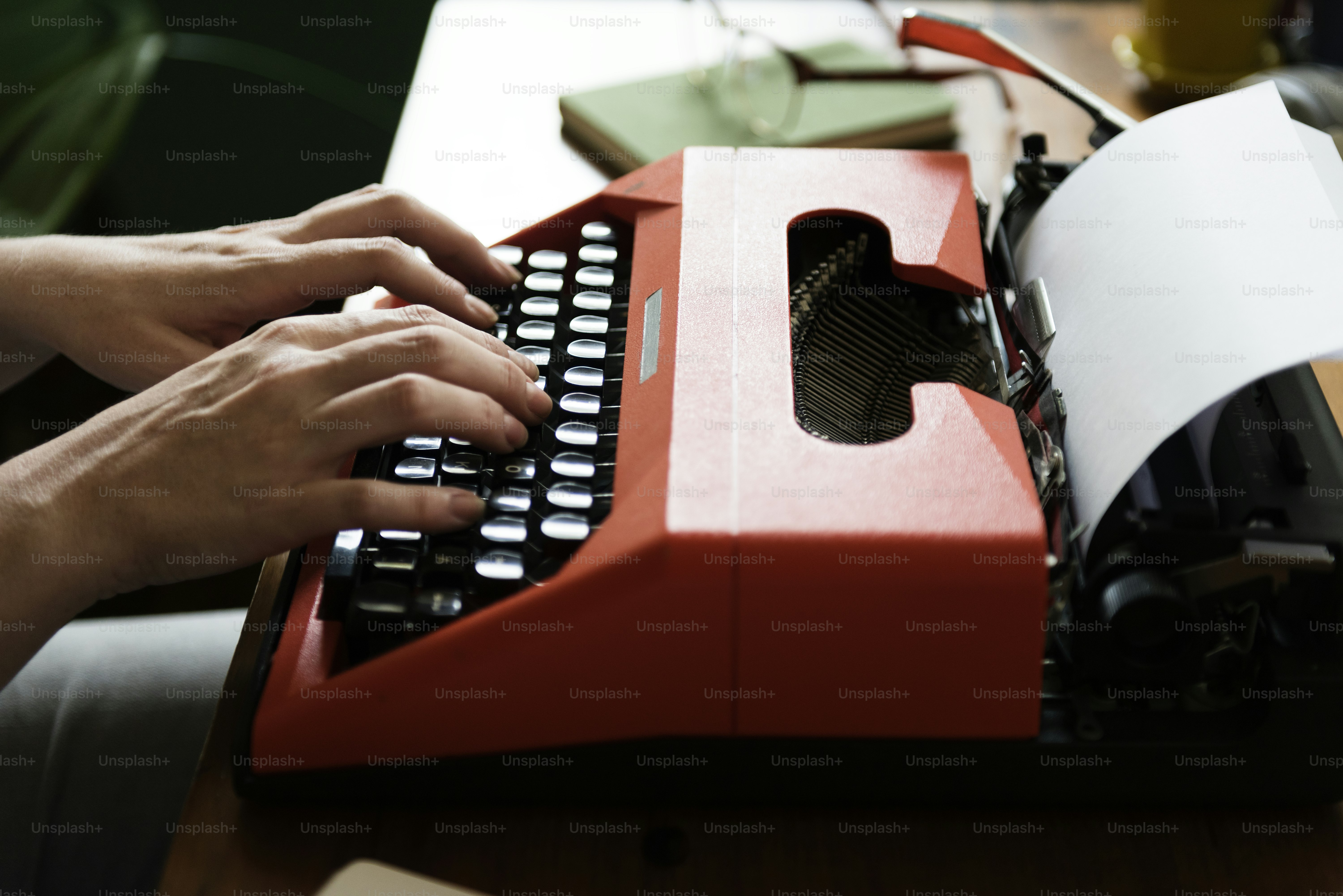 Woman typing on a retro typewriter