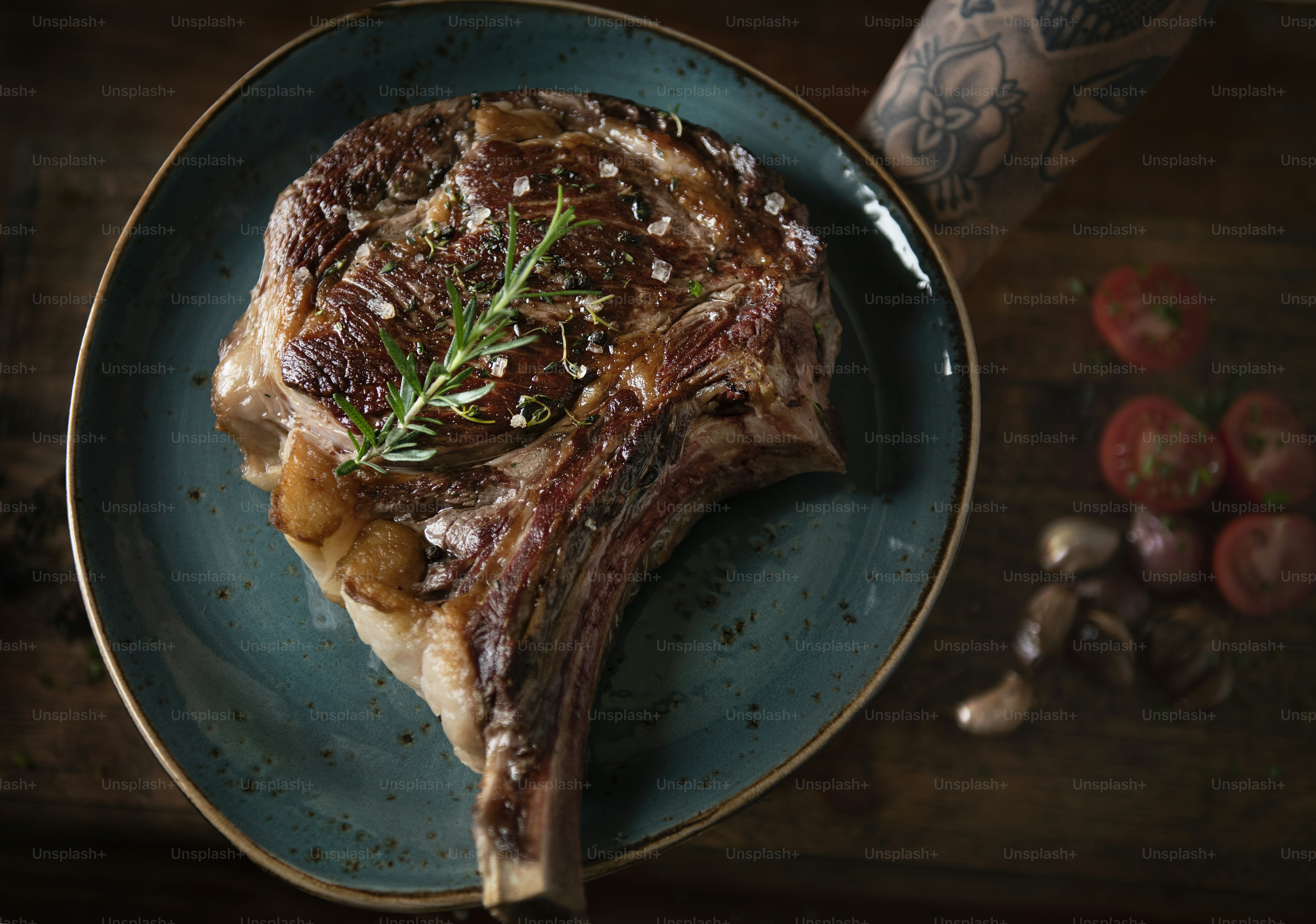 Tomahawk on a plate with garnish food photography recipe idea