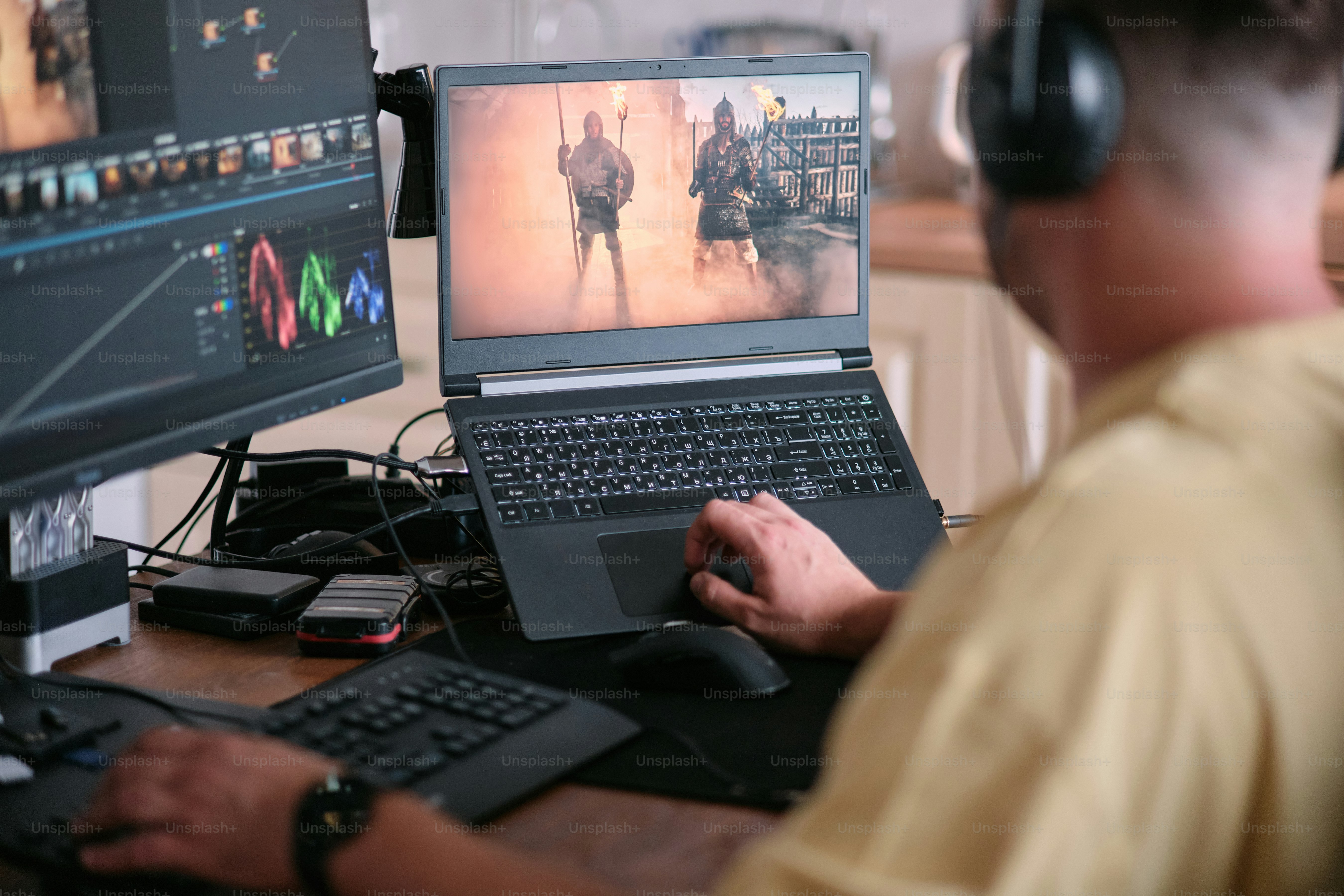 A man sitting in front of a laptop computer