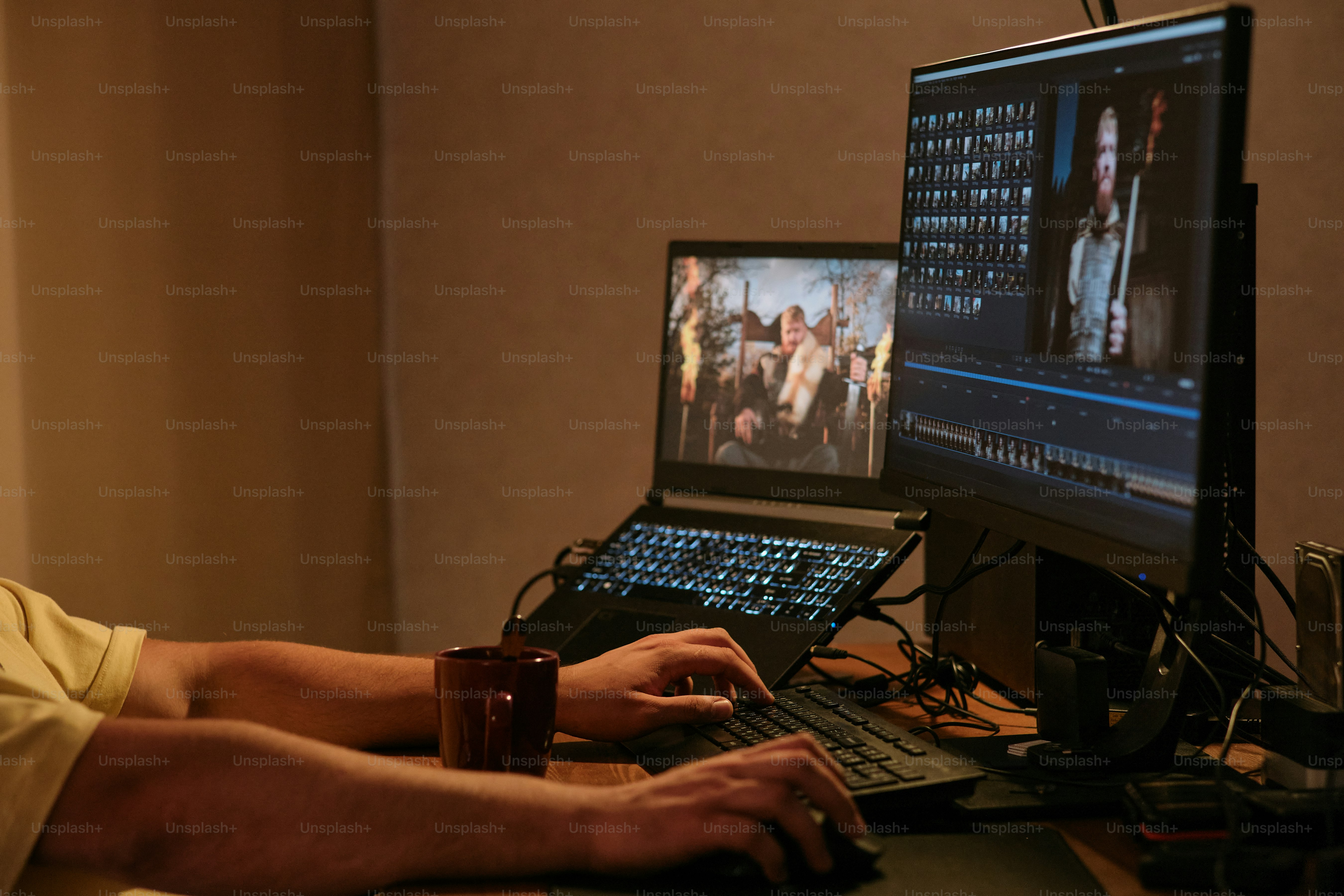 A man sitting in front of a laptop computer