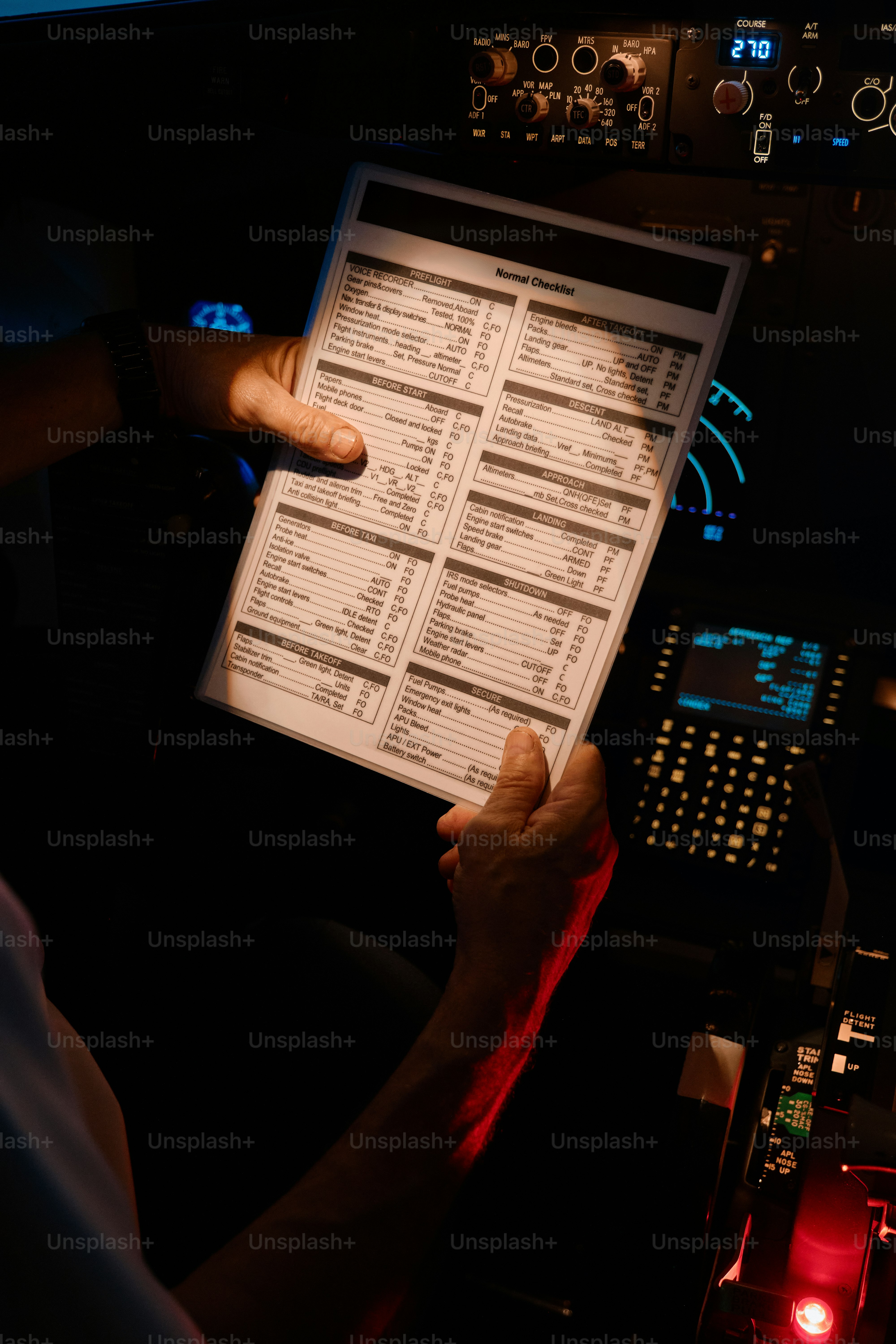 A person holding a piece of paper in their hand