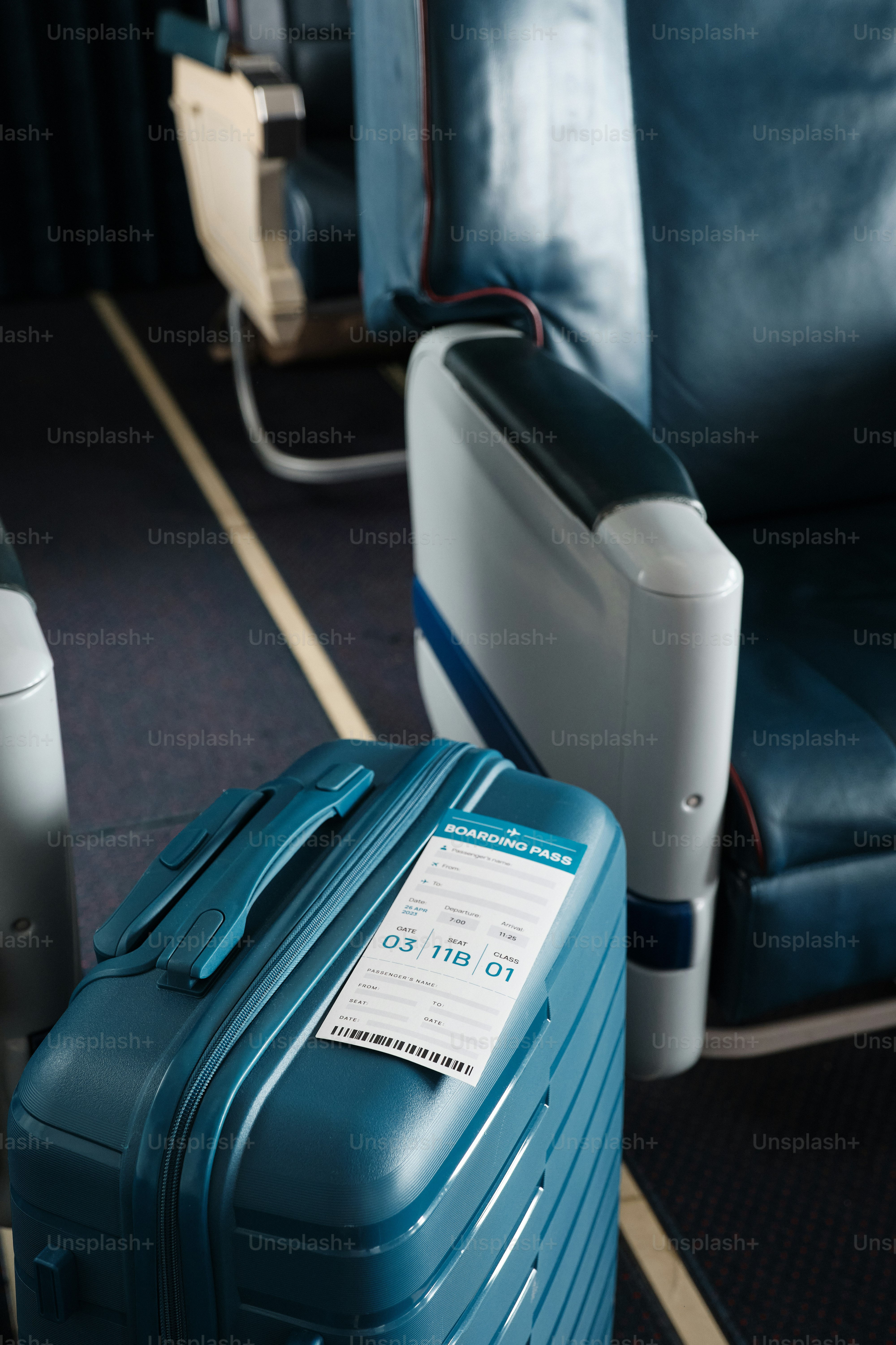 A blue suit case sitting on top of a blue carpeted floor