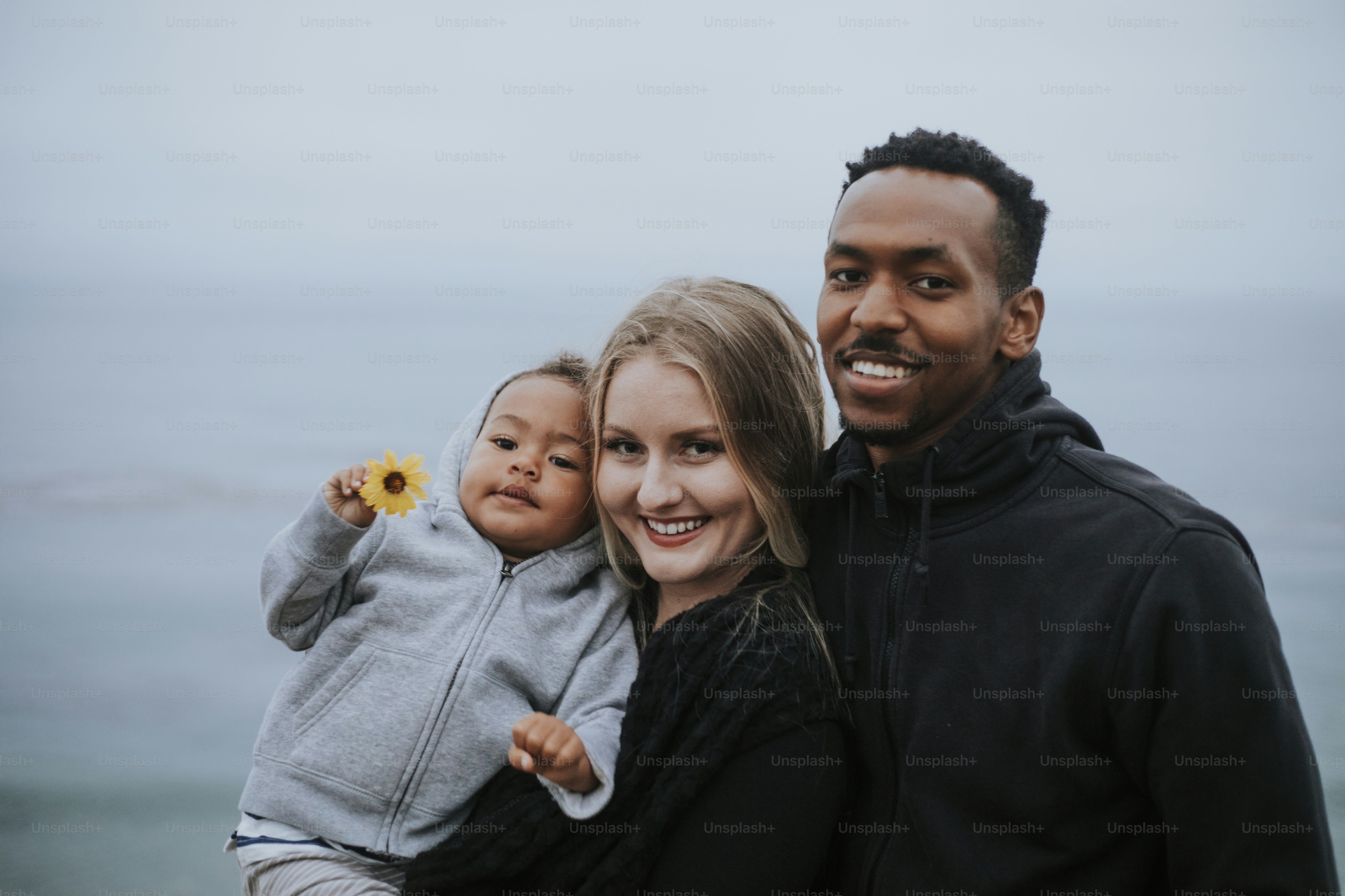 Happy family by the water