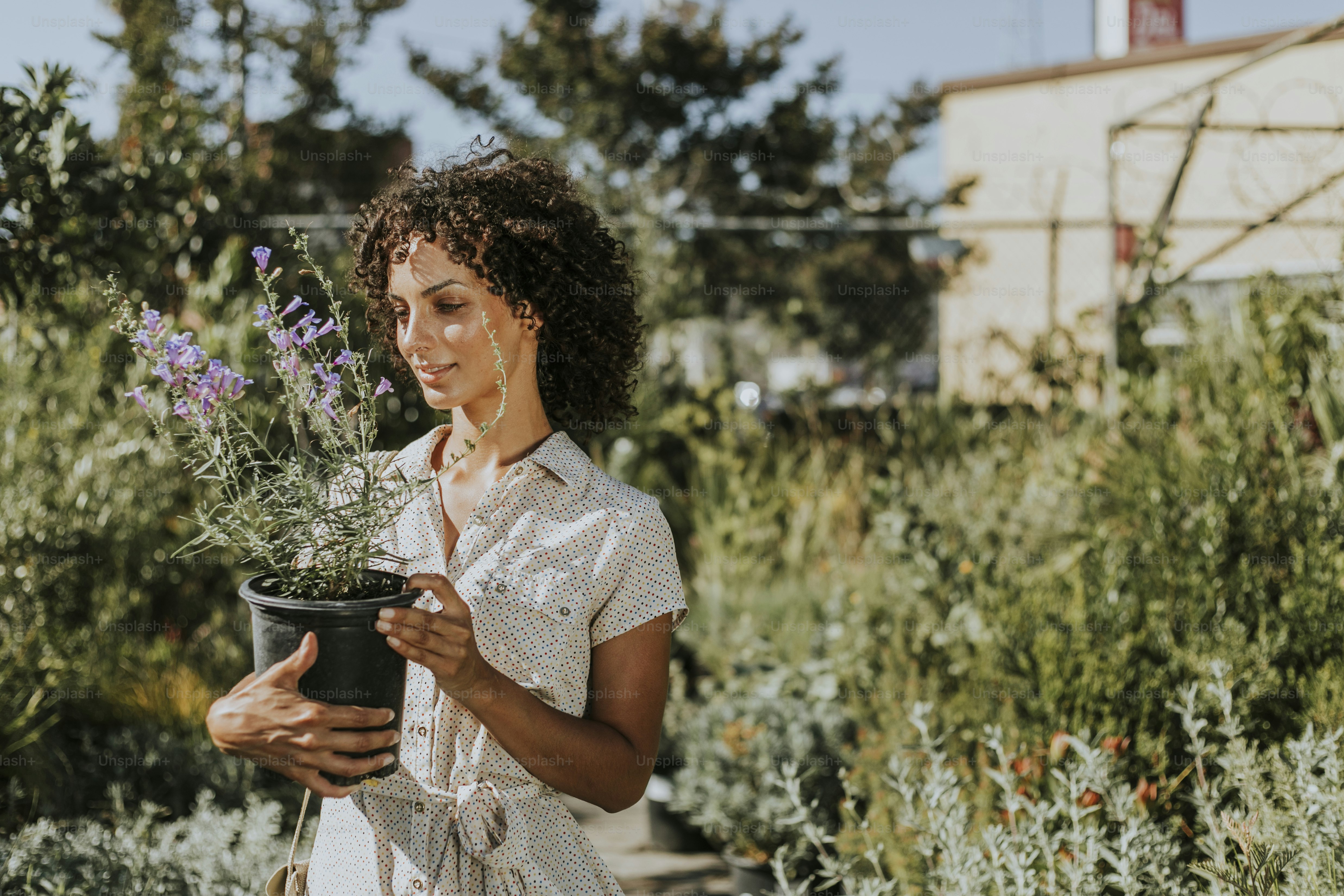 Woman buying flowers at a nursery