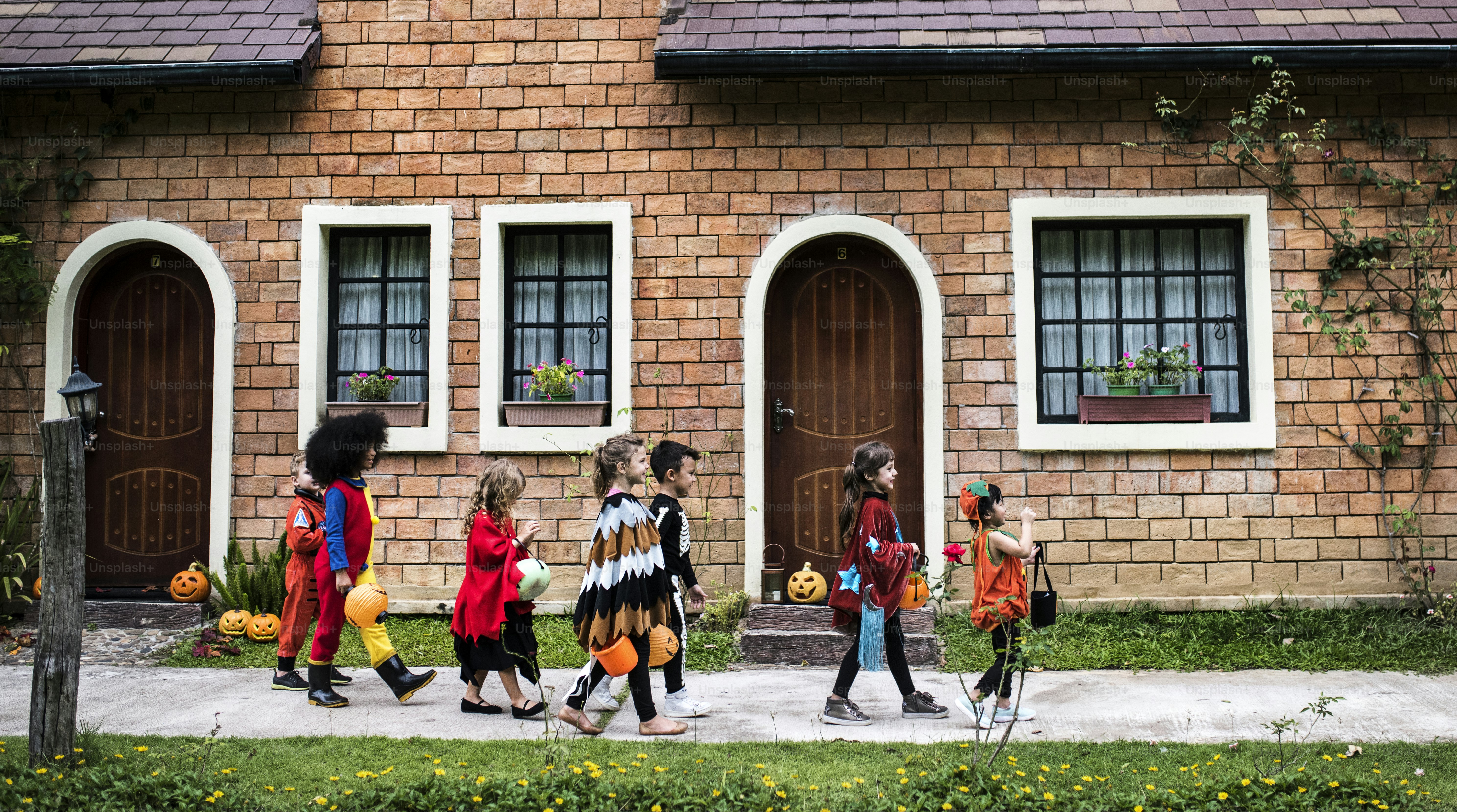 Young kids trick or treating during Halloween