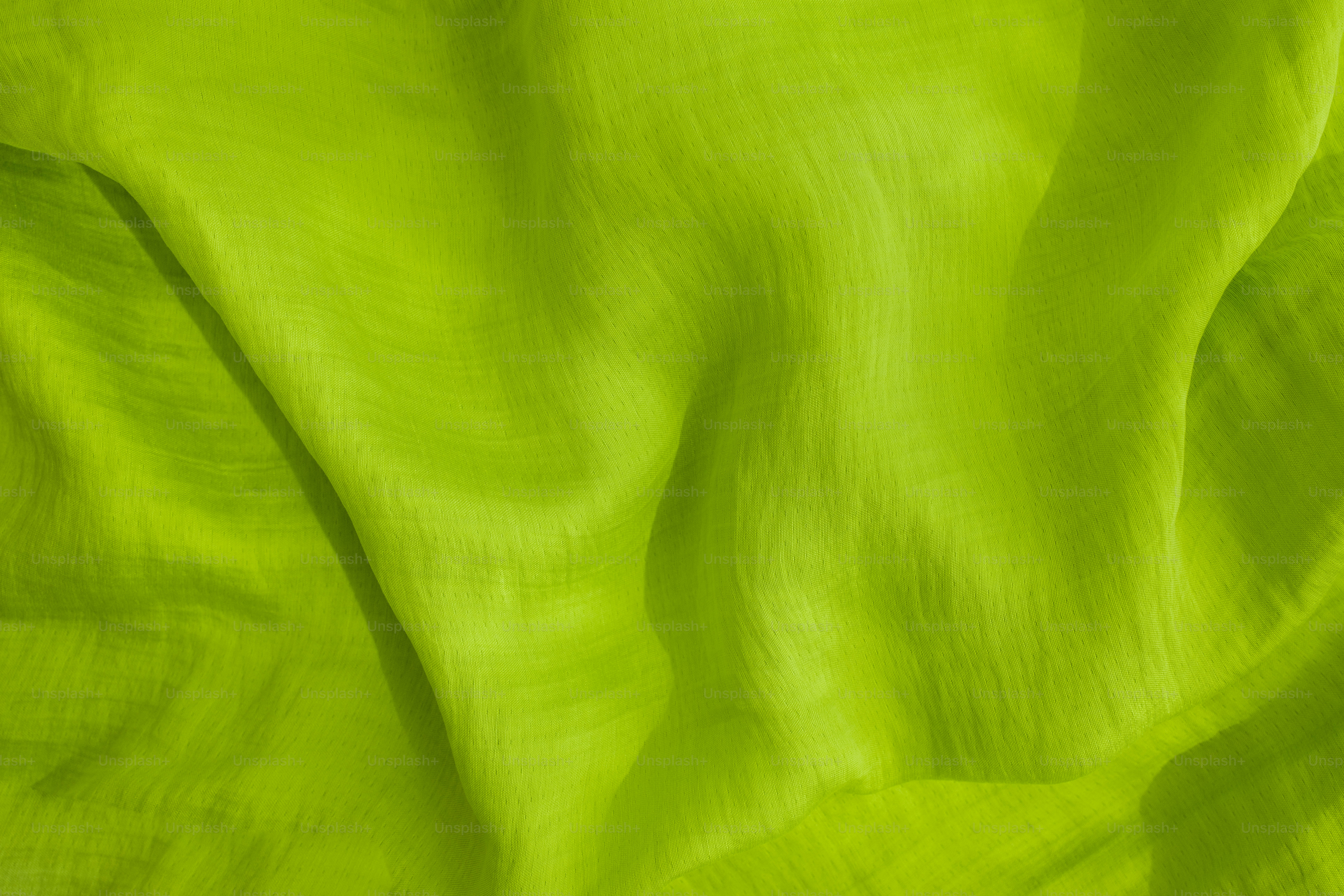 Nahaufnahme eines lindgrünen Stoffes