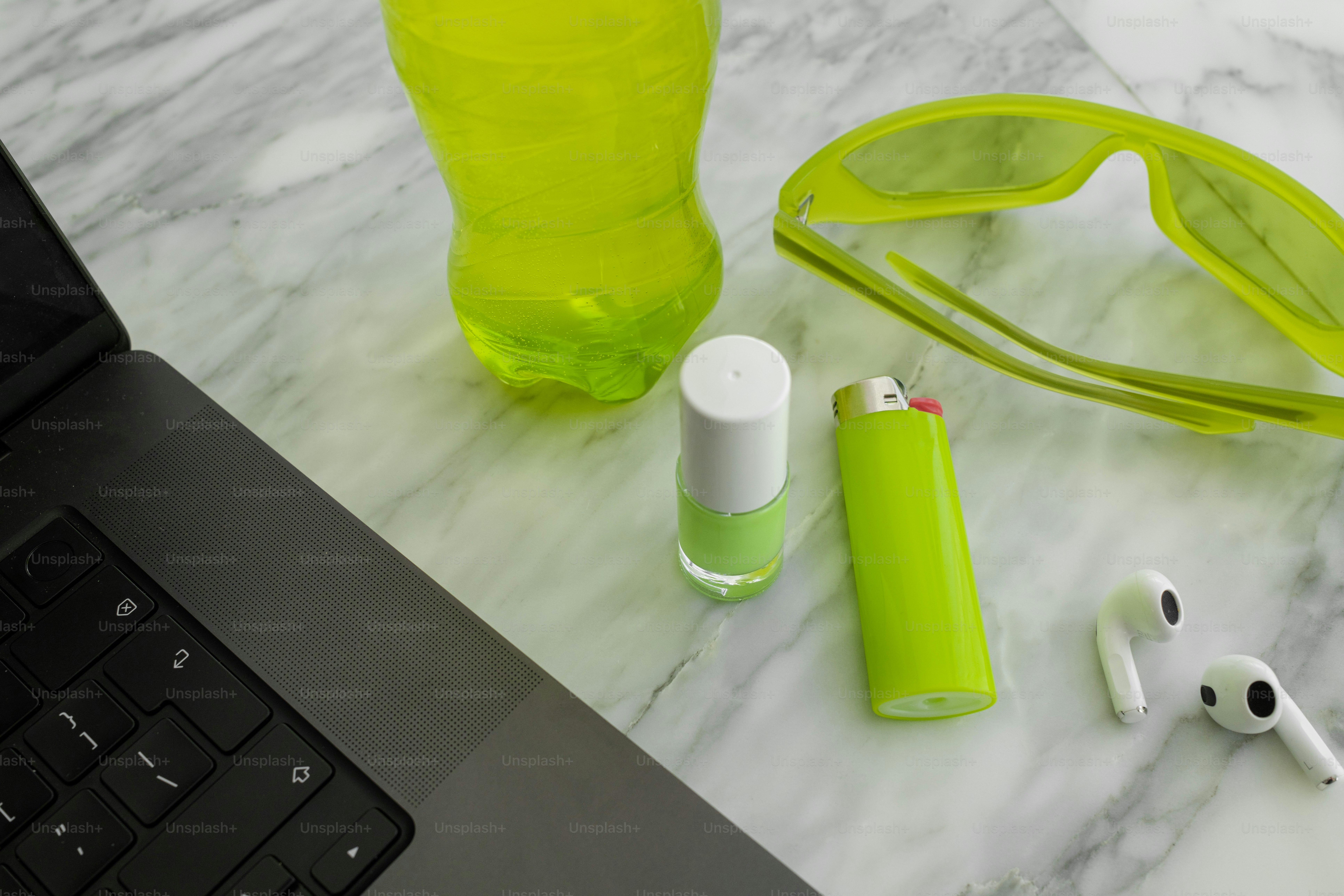 A laptop computer sitting on top of a marble table
