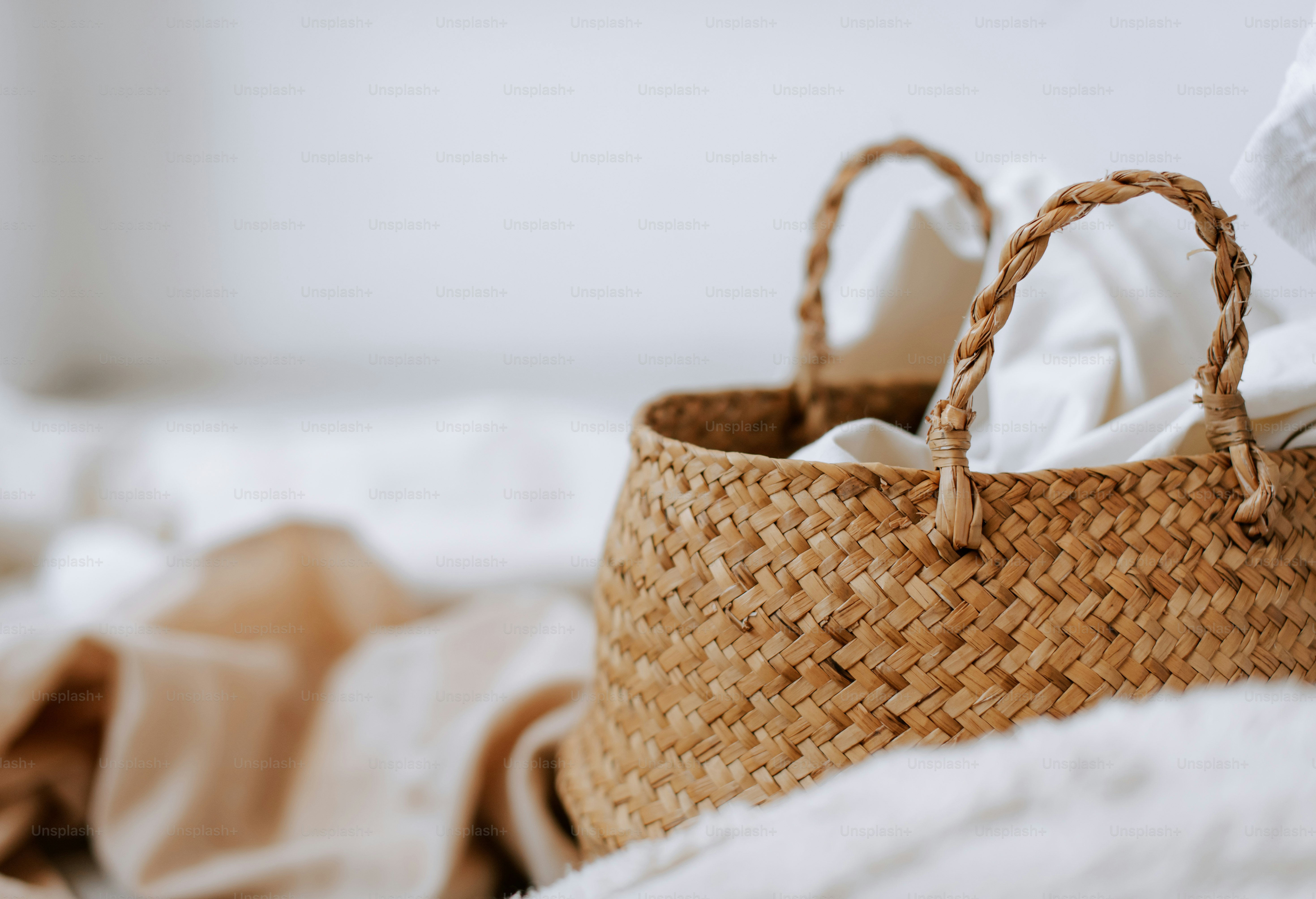 A close up of a basket on a bed