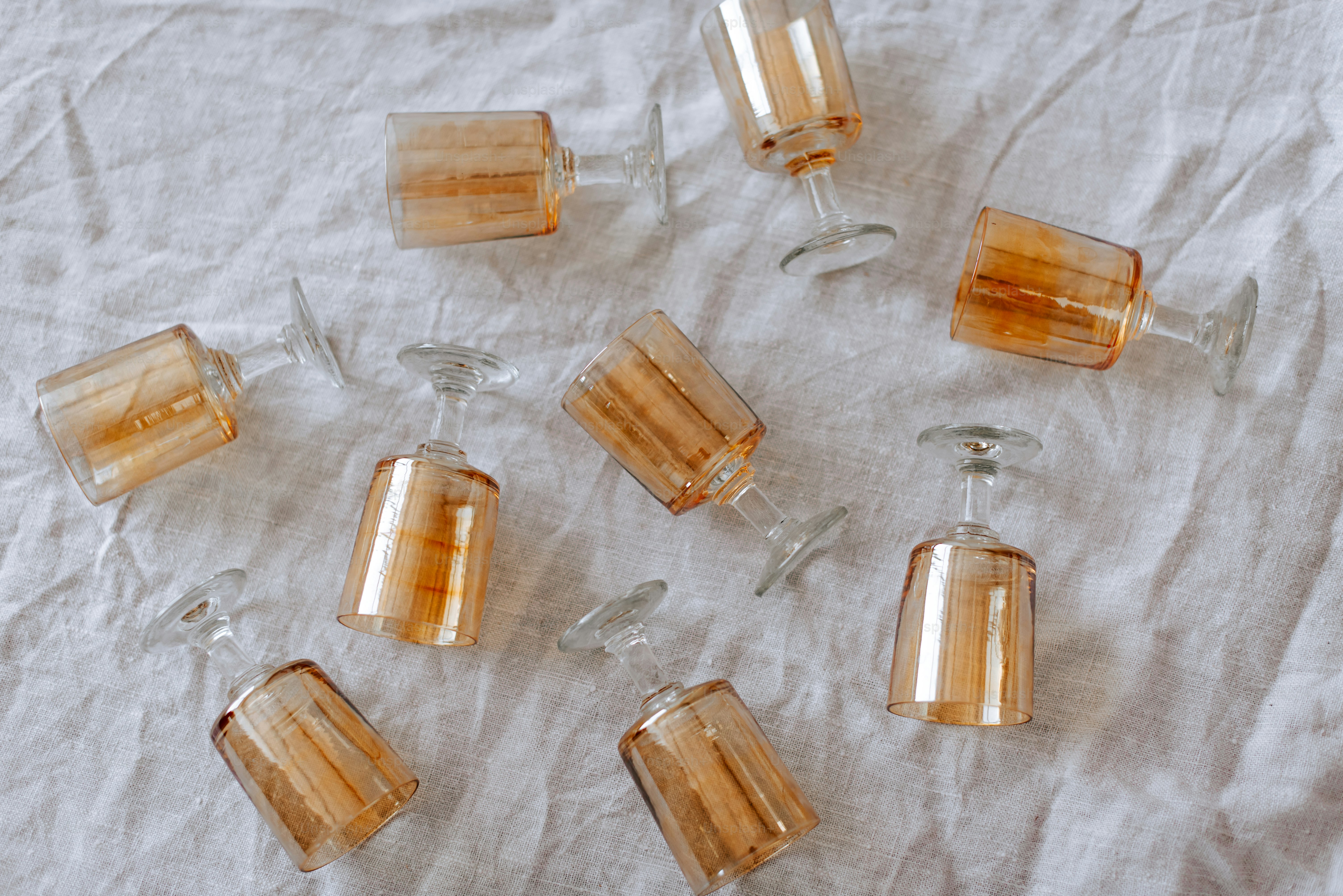 A group of small glass vases sitting on top of a table photo – Neutral ...