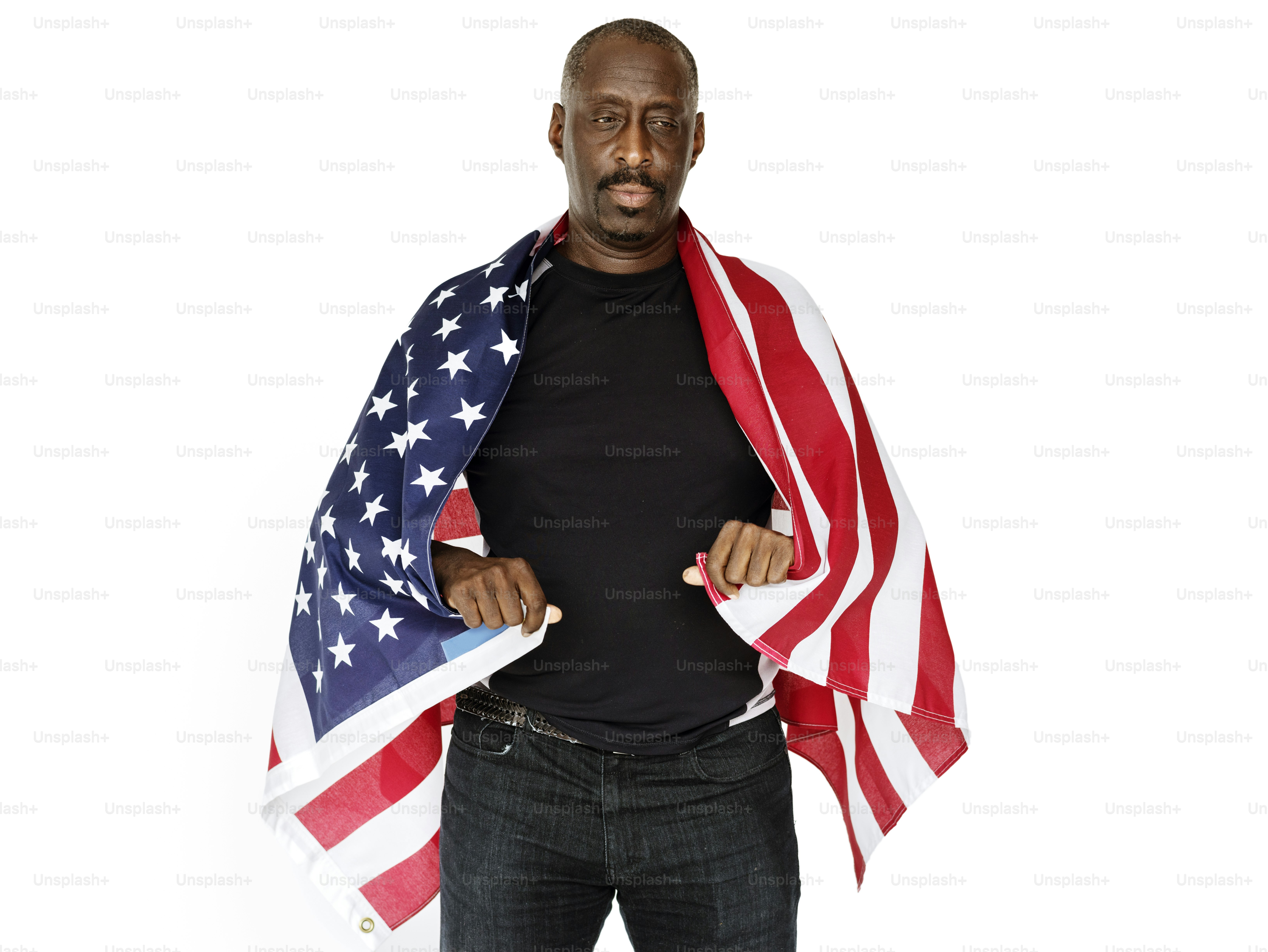 African descent man holding united states of america flag