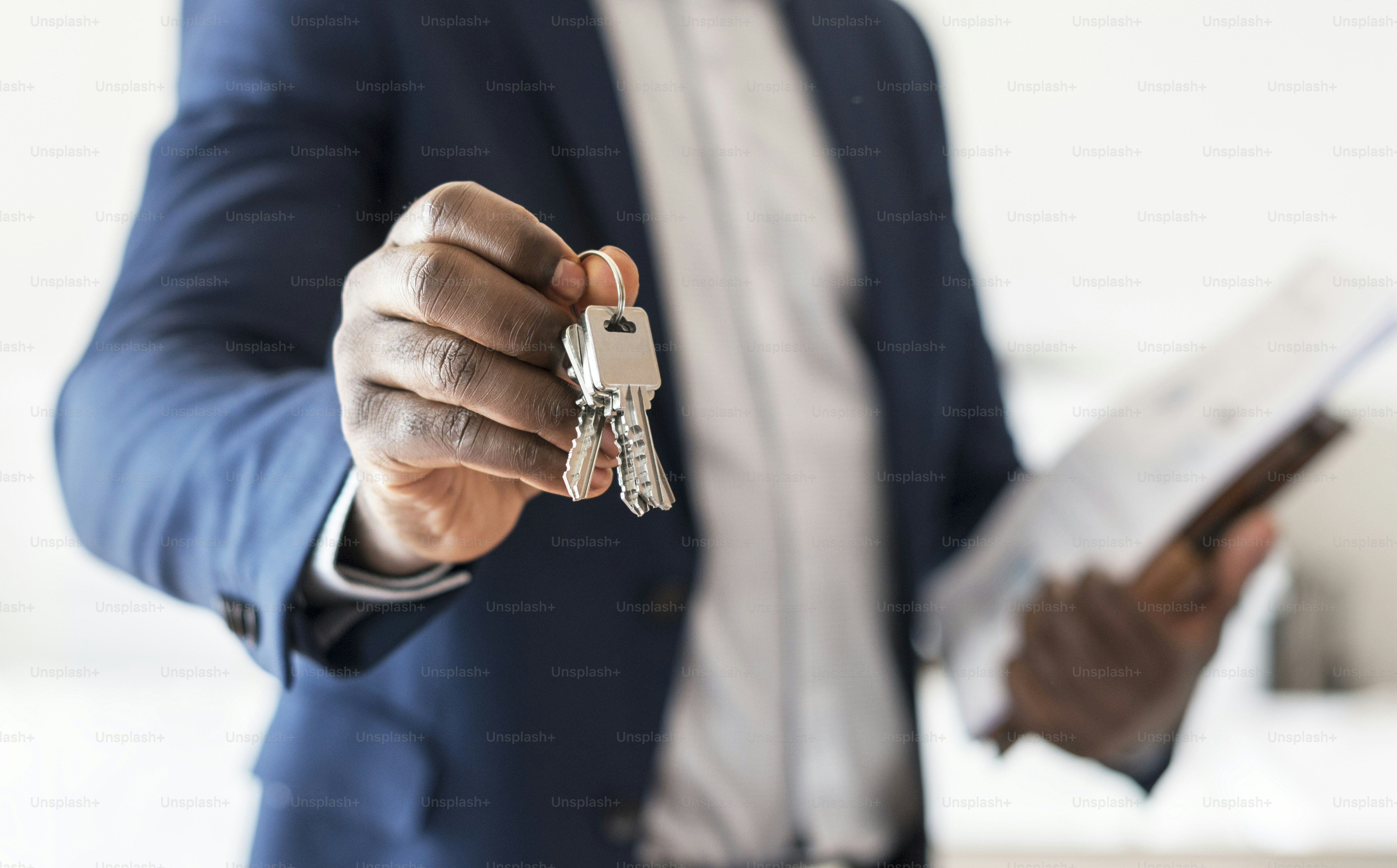 Real estate agent handing the house key photo – Home Image on Unsplash