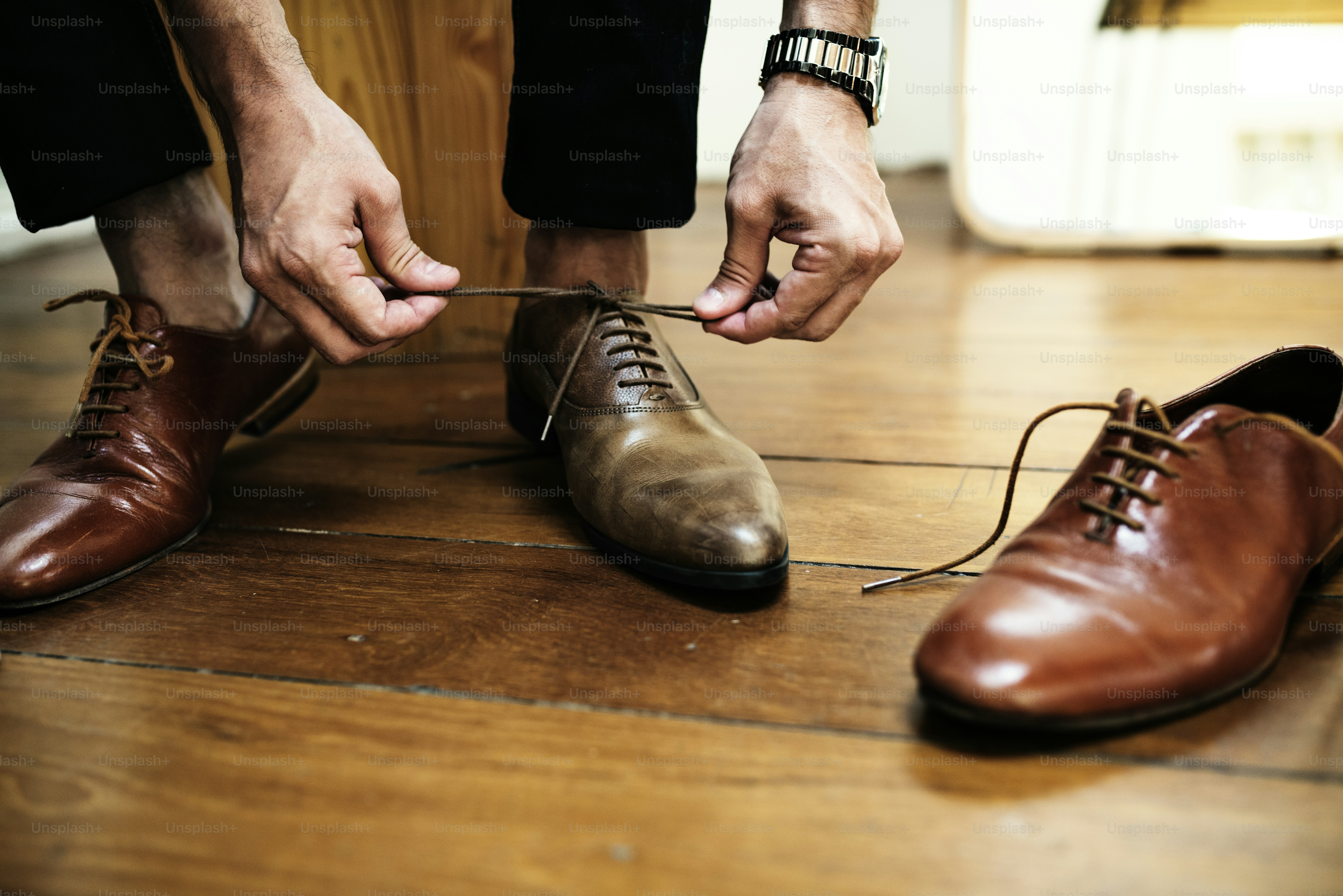 Man tying up his shoes