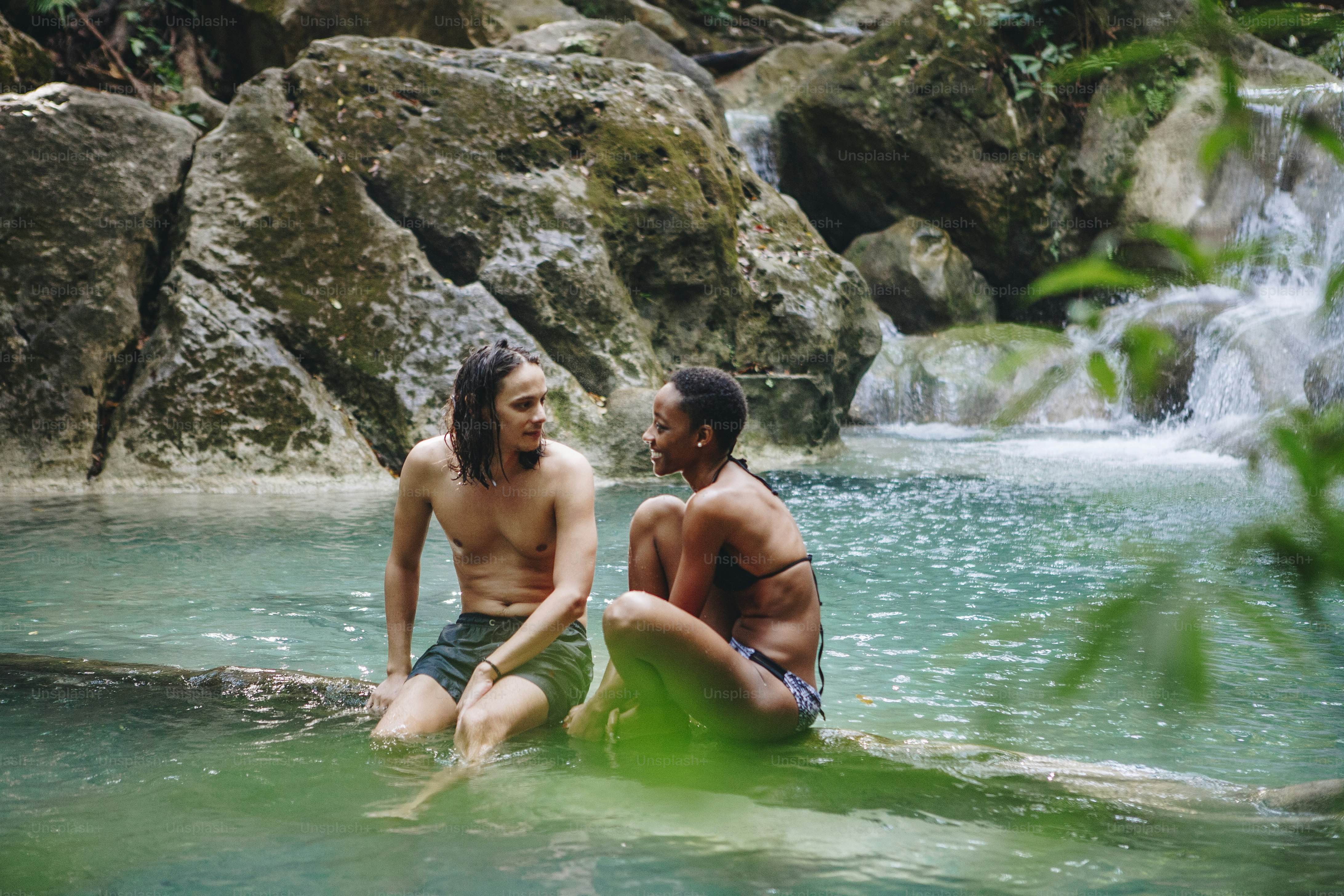 Couple enjoying the waterfall