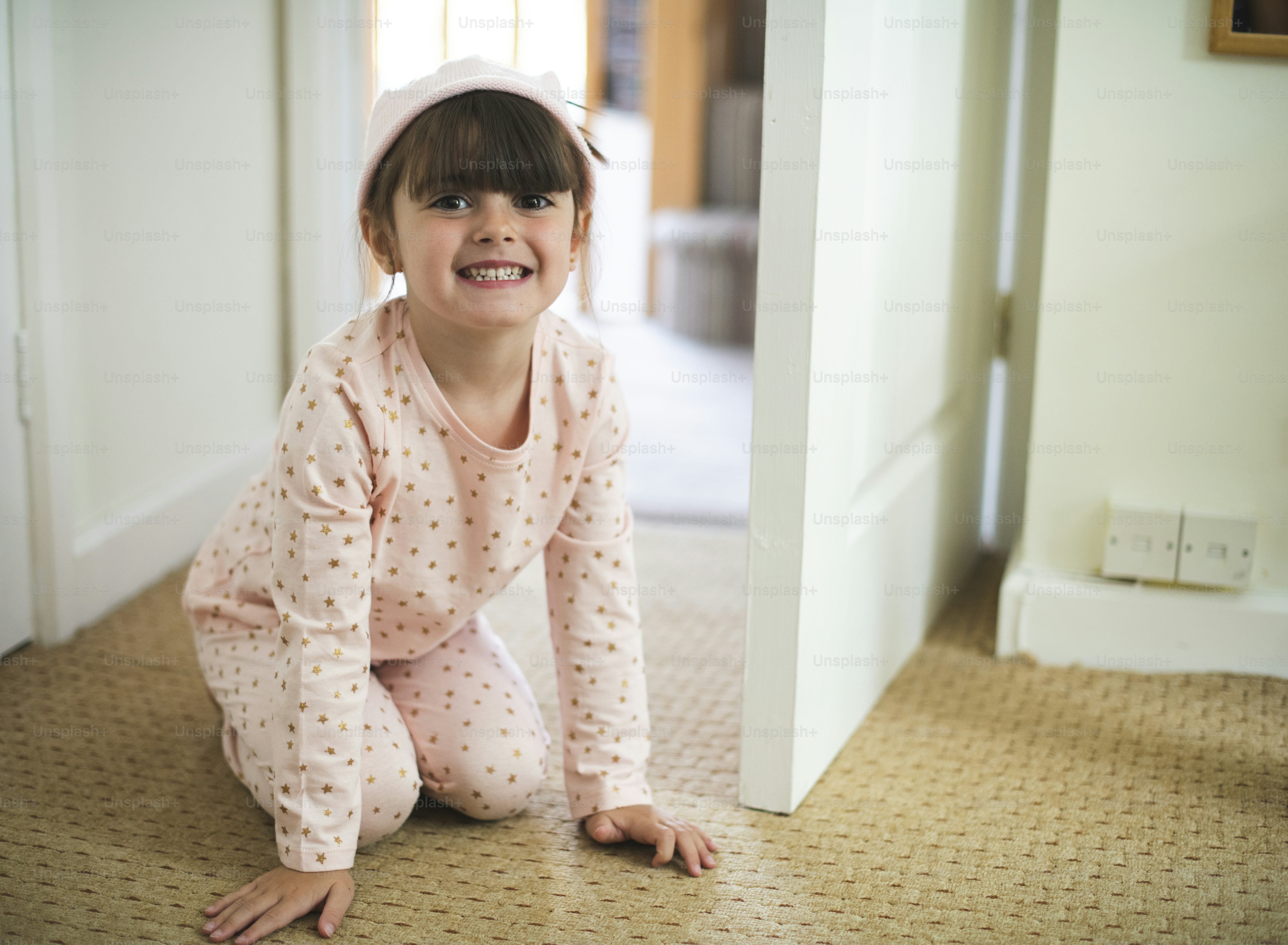 Happy girl on the bathroom floor