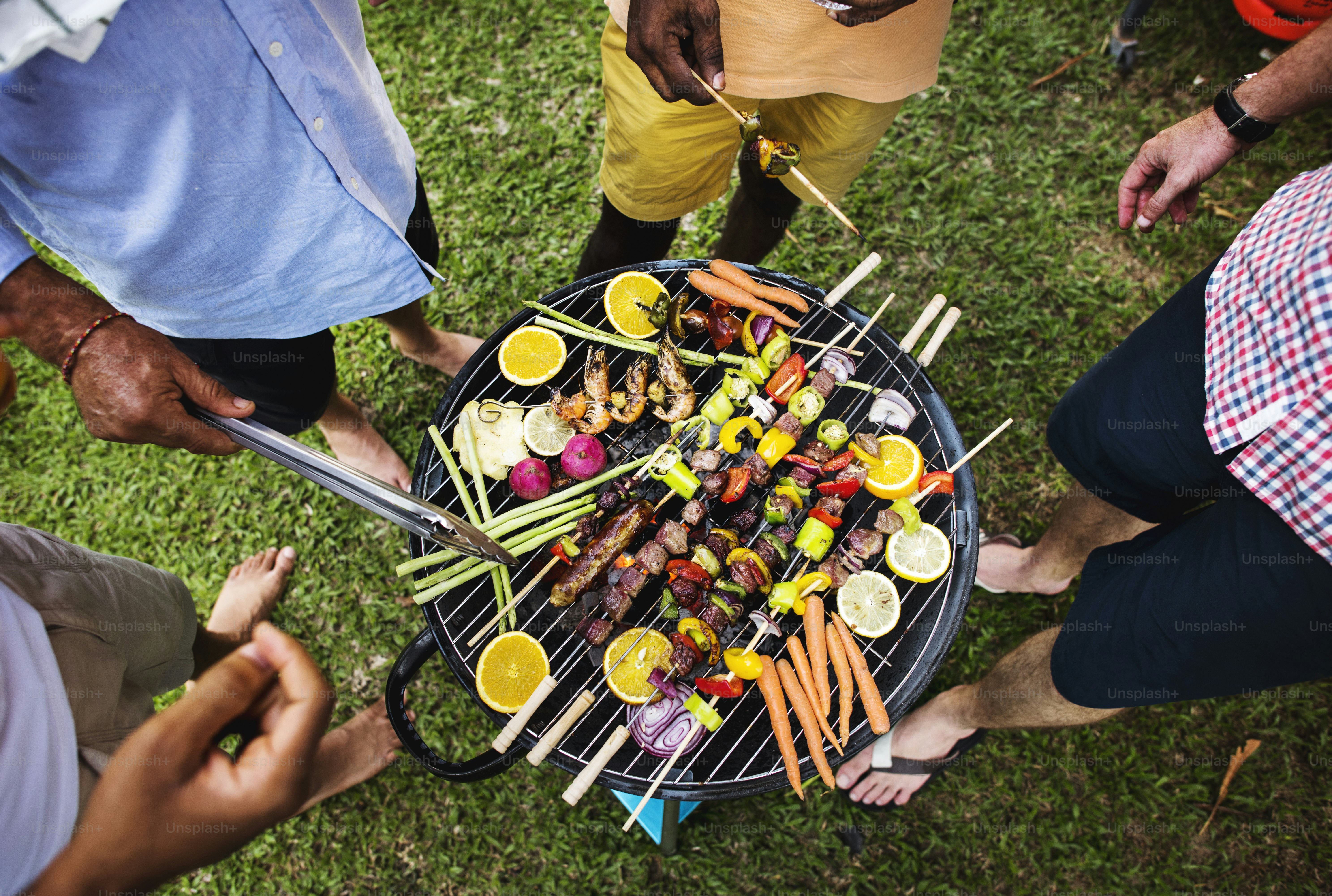 Diverse people enjoying barbecue party together photo – Food Image on ...