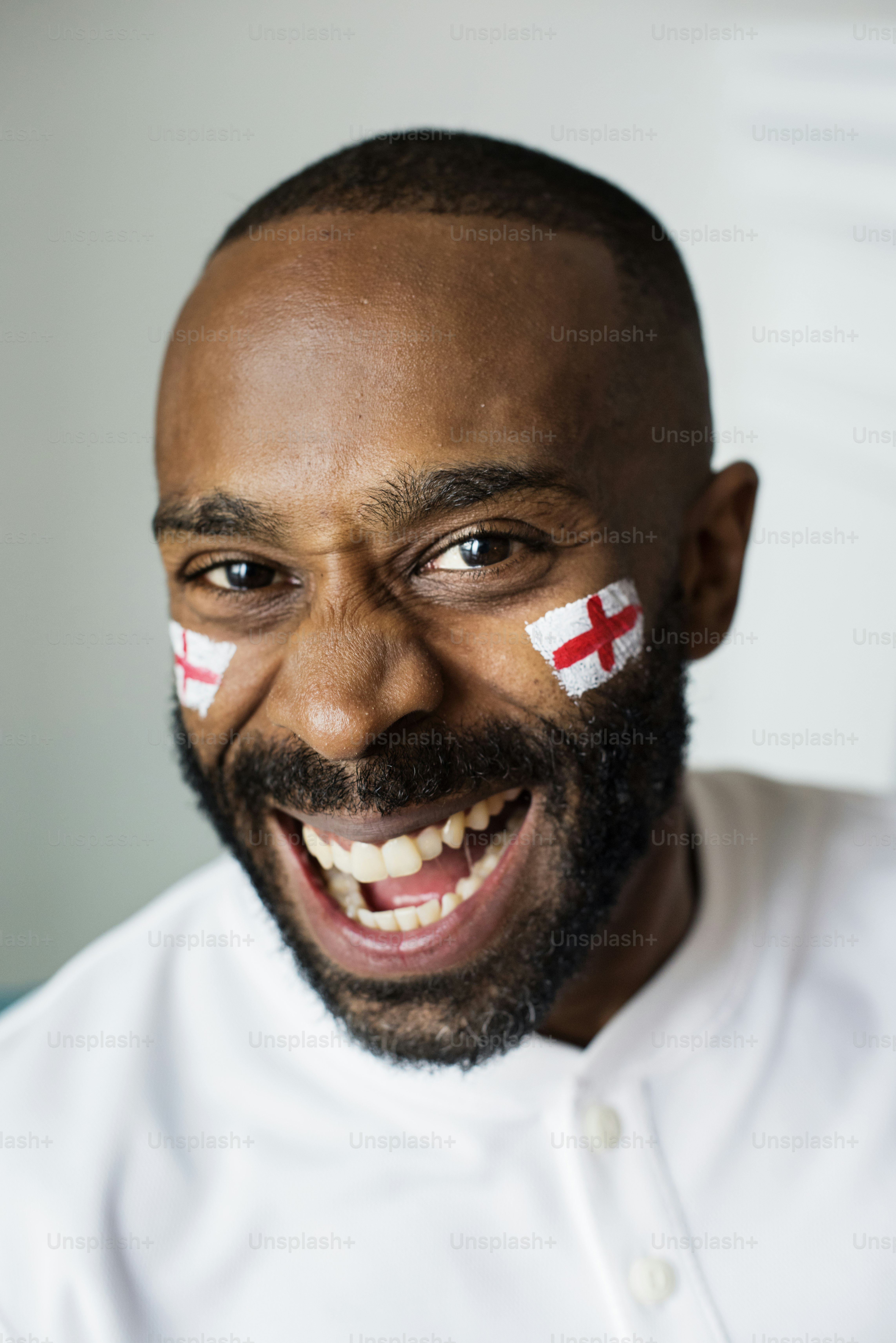 Friends cheering world cup with painted flag