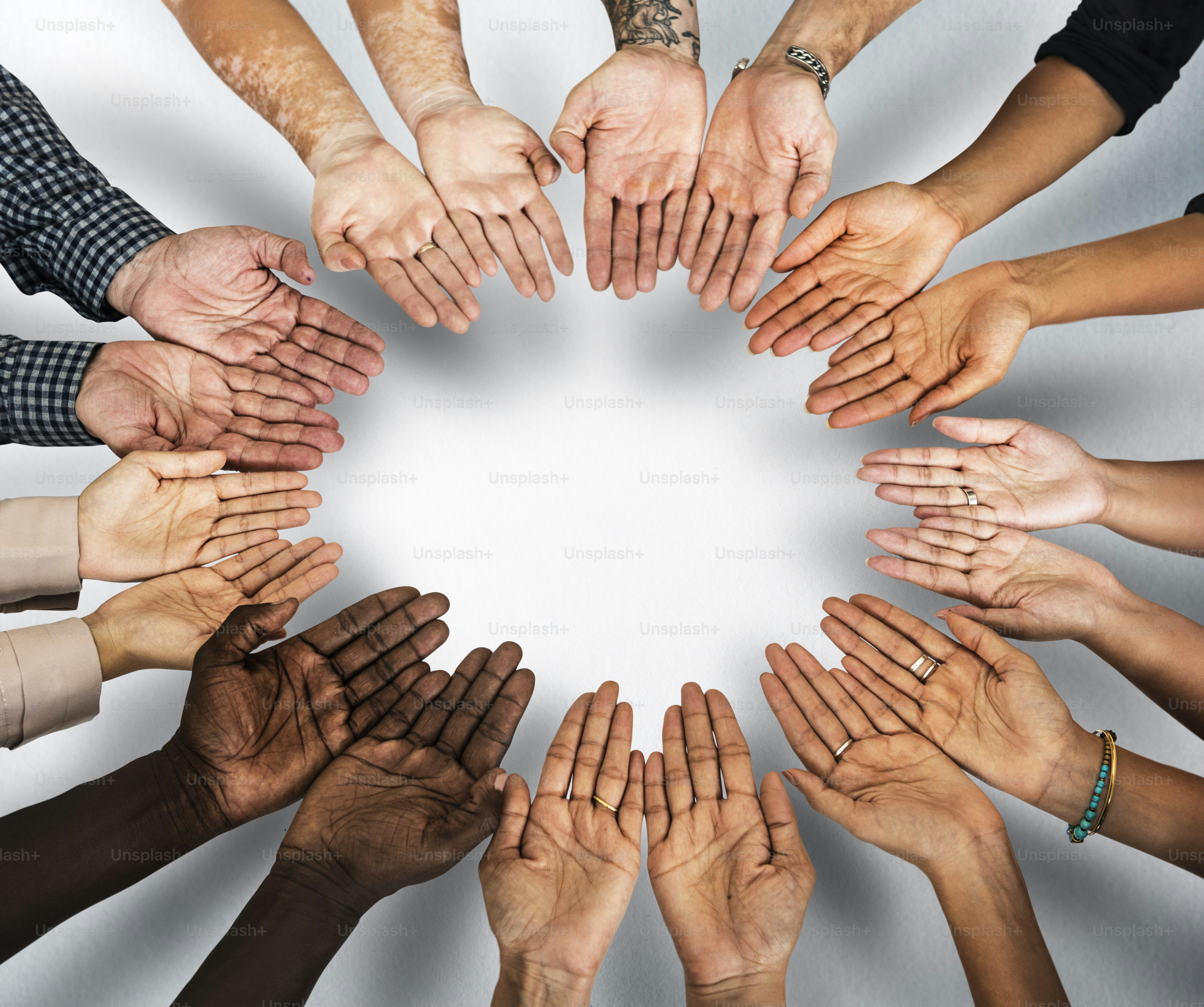 DIverse hands are together in a circle shape