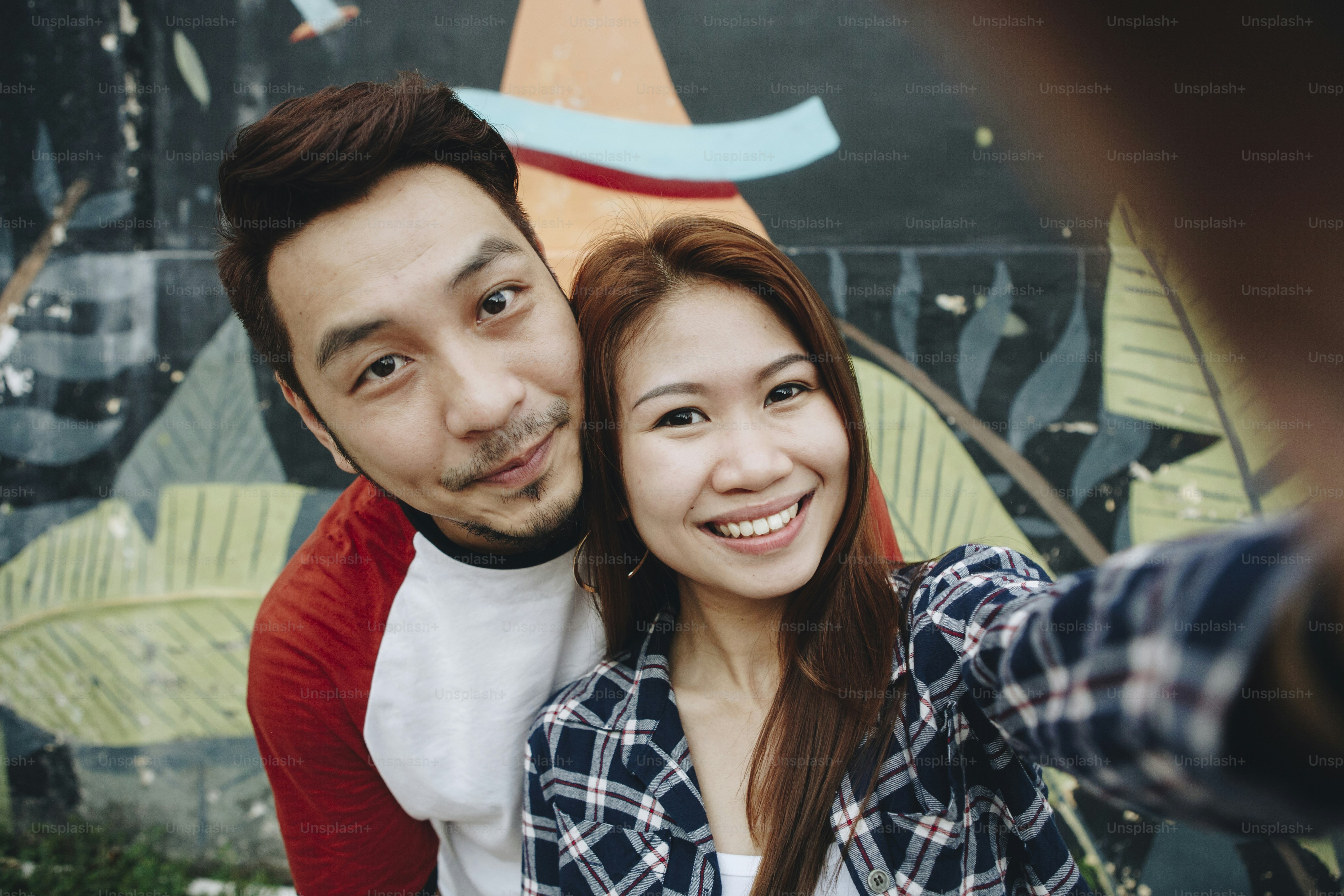 Happy couple taking selfie together