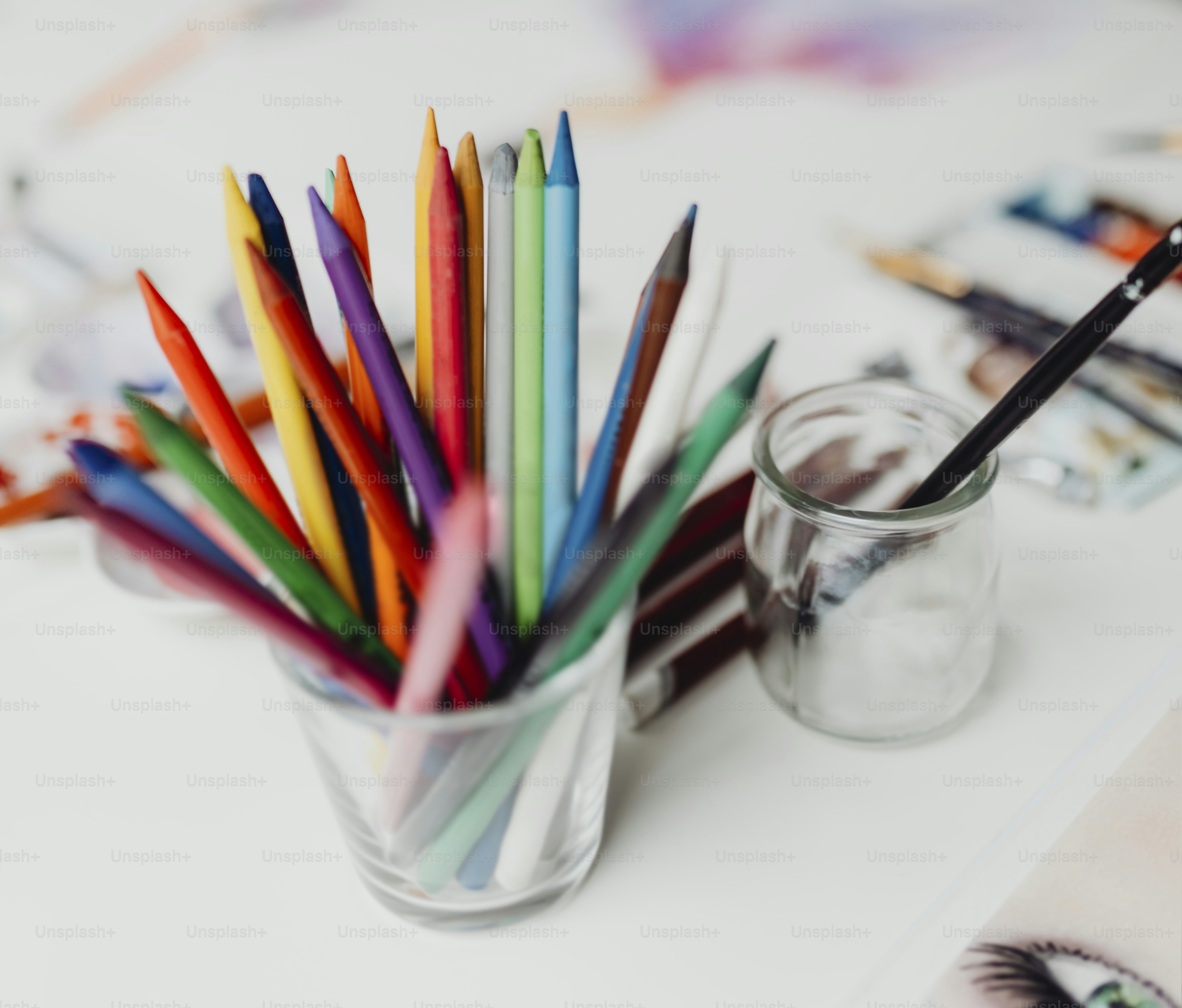 Colorful crayons in a glass
