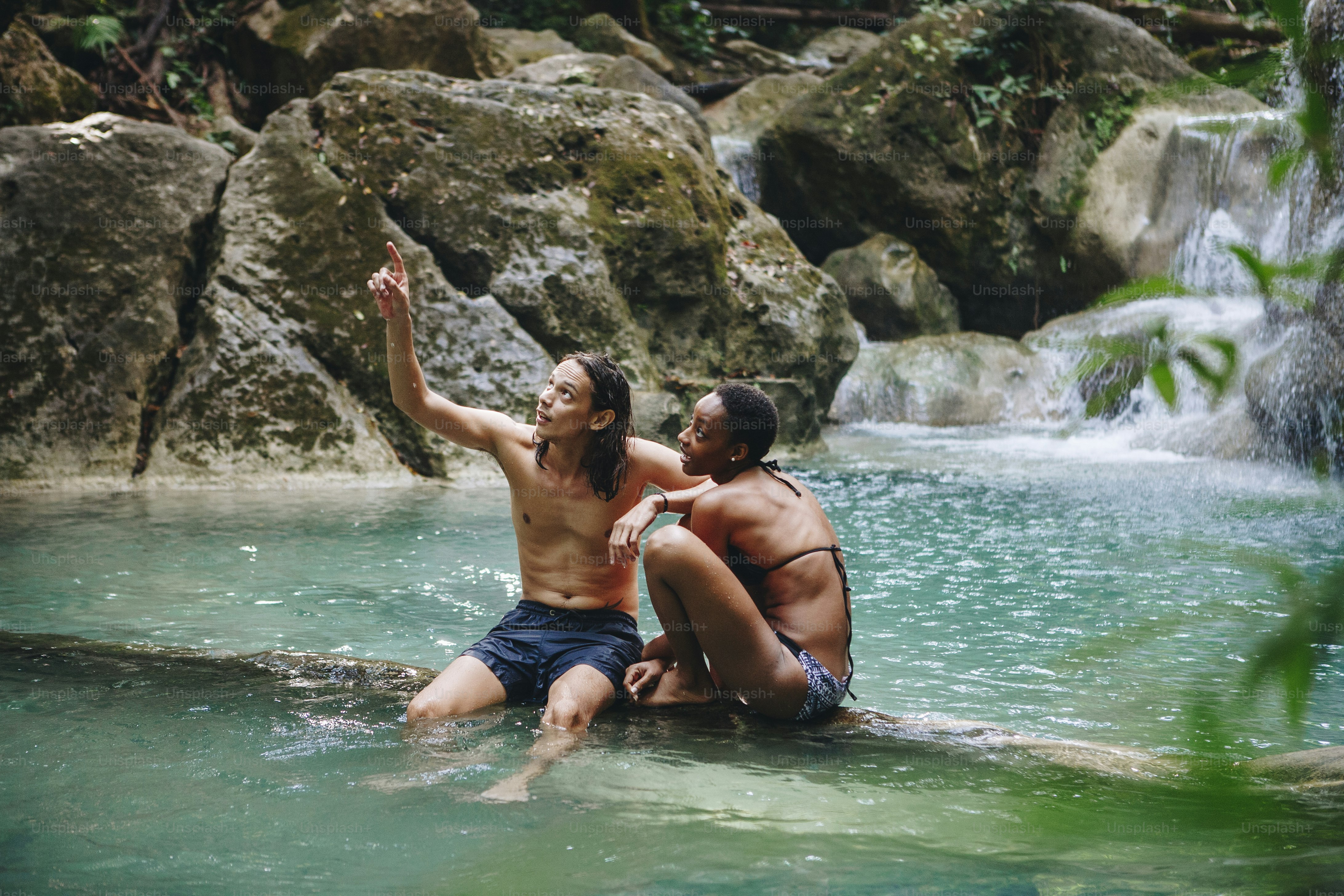Couple enjoying the waterfall