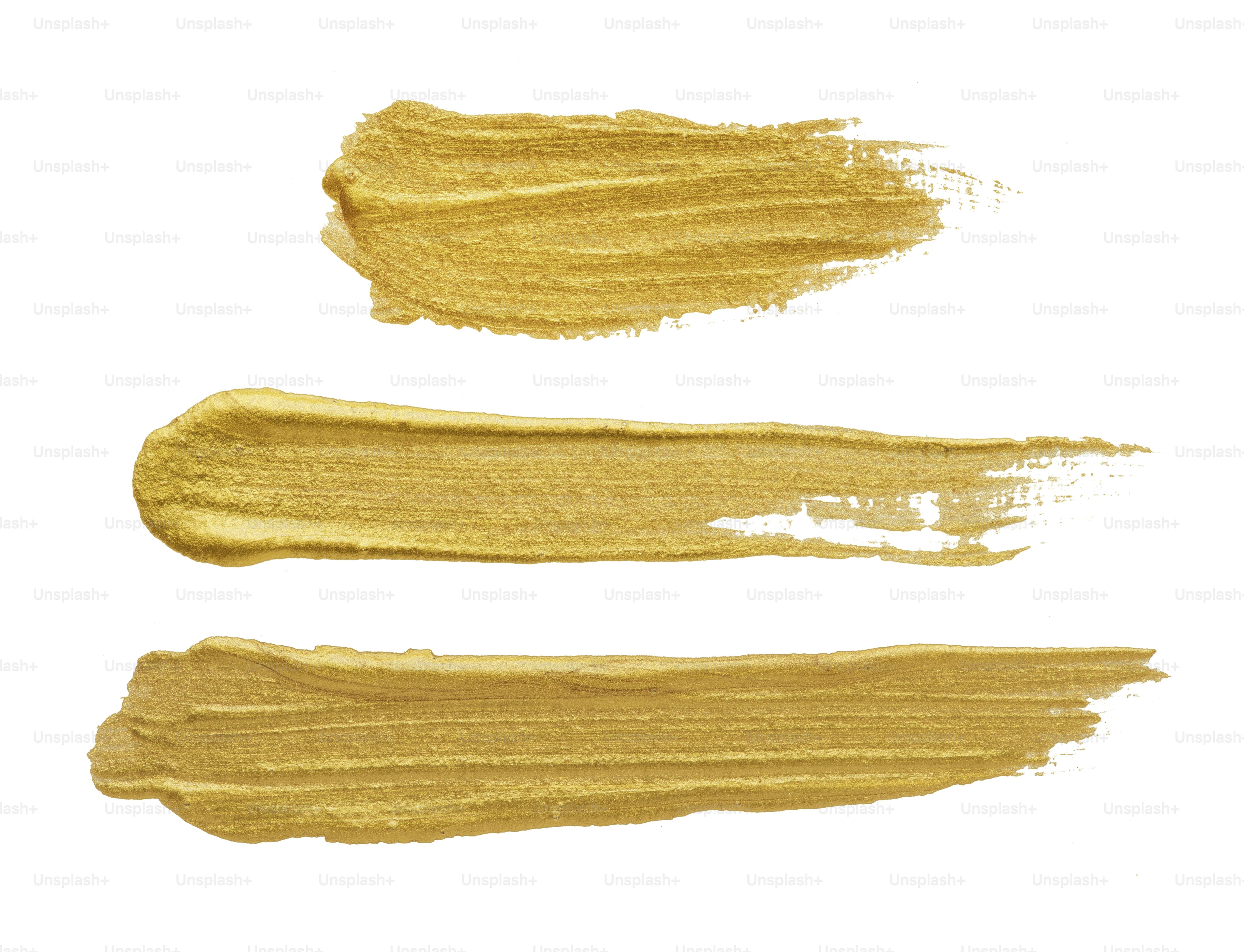 Goldener Pinselstrich auf Weiß