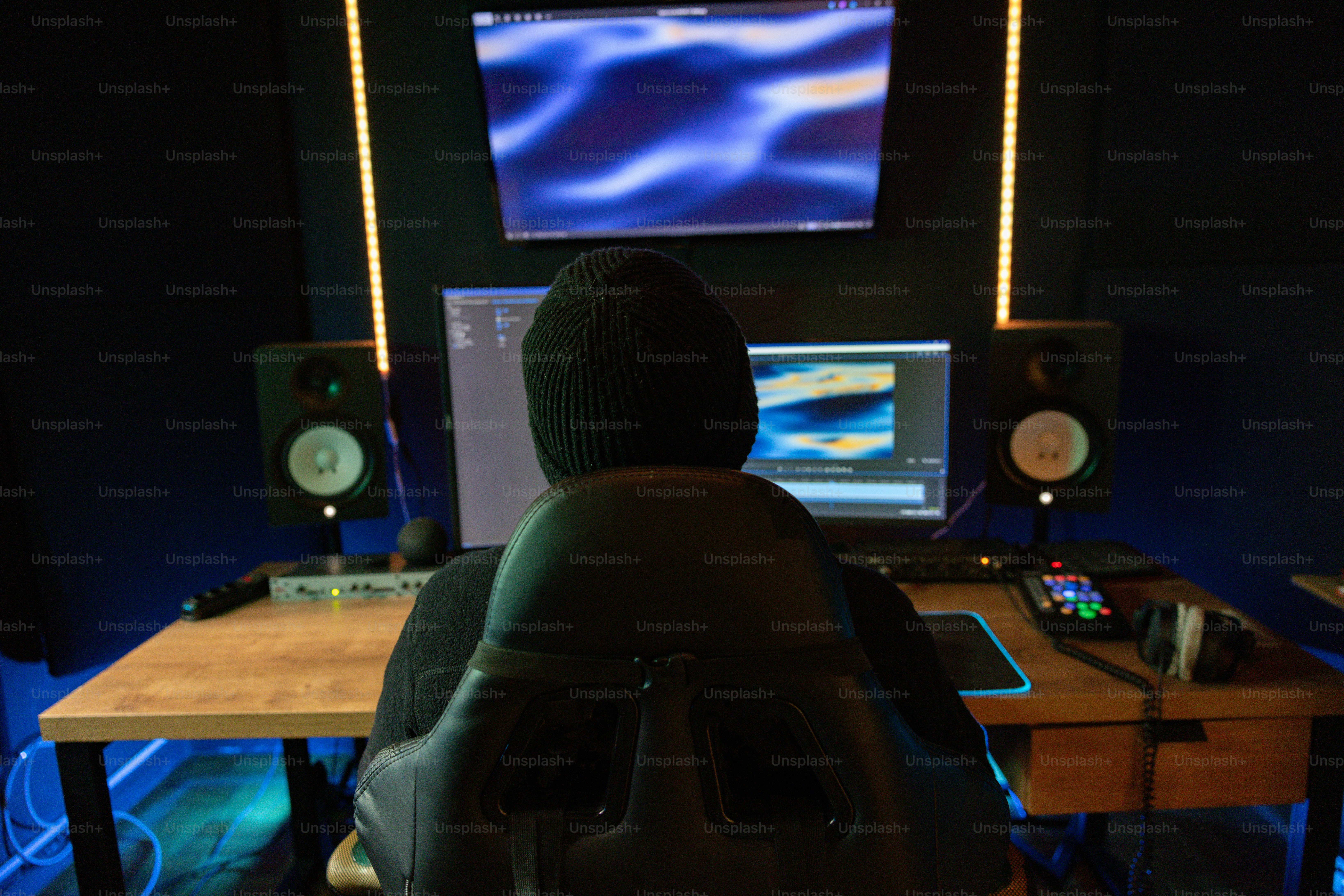 A man sitting in front of a computer monitor