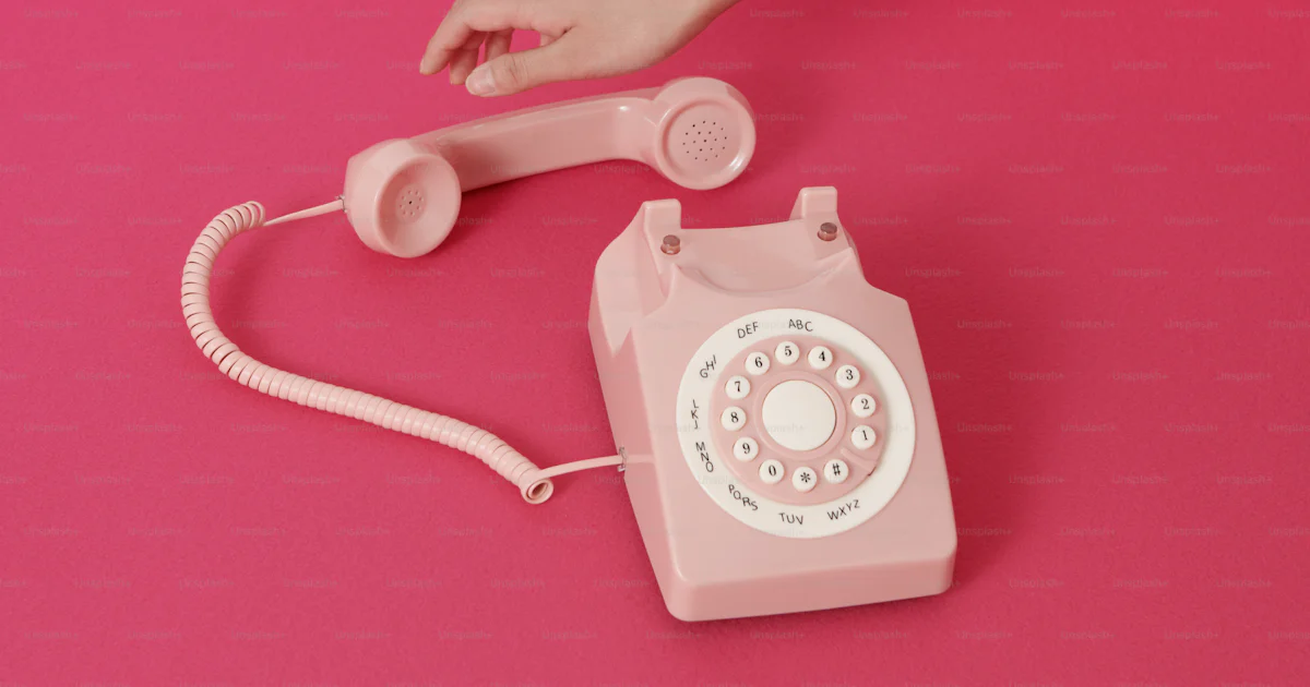 A pink phone sitting on a pink surface photo – Telephone Image on Unsplash