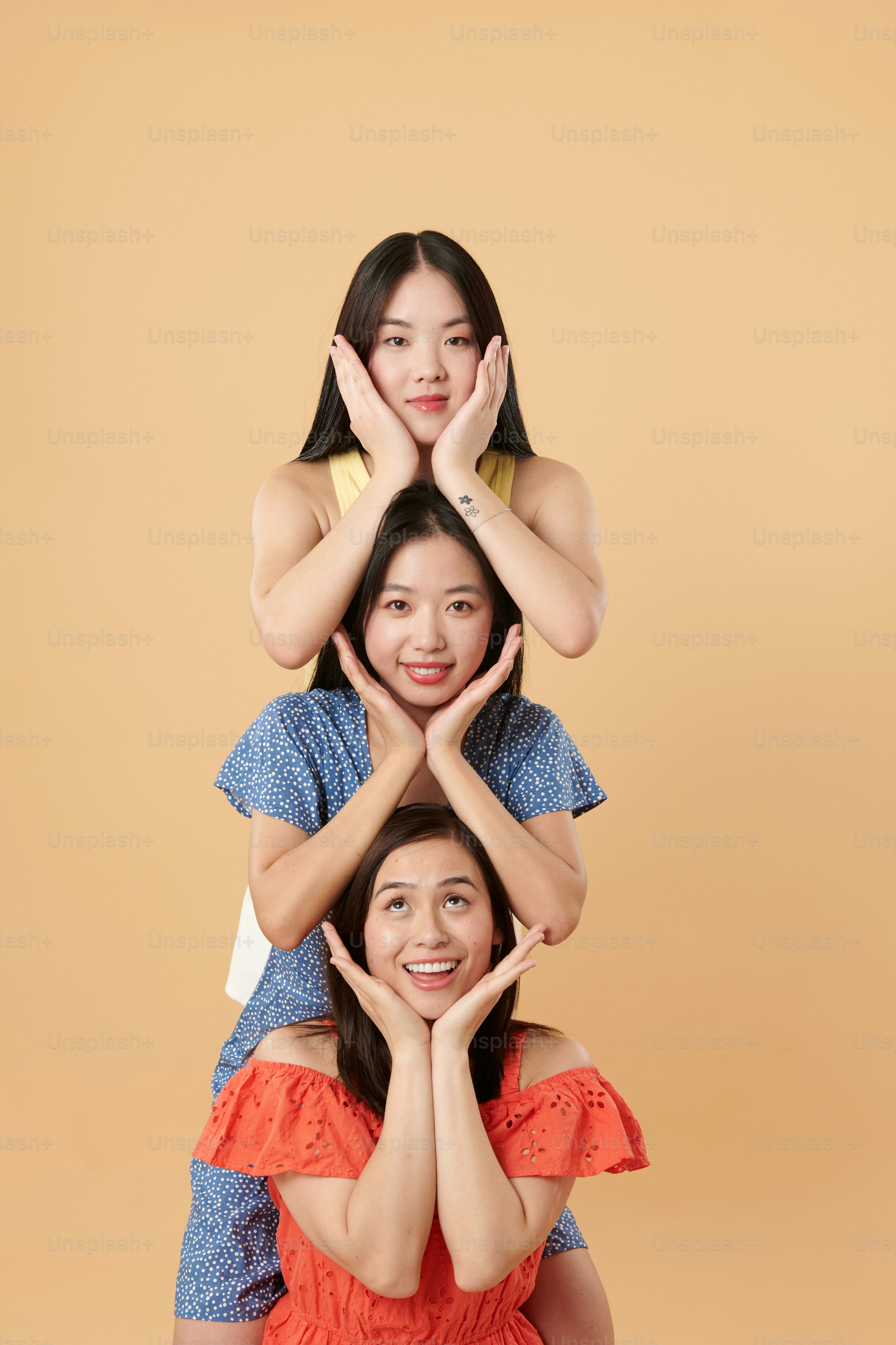 A group of women standing on top of each other