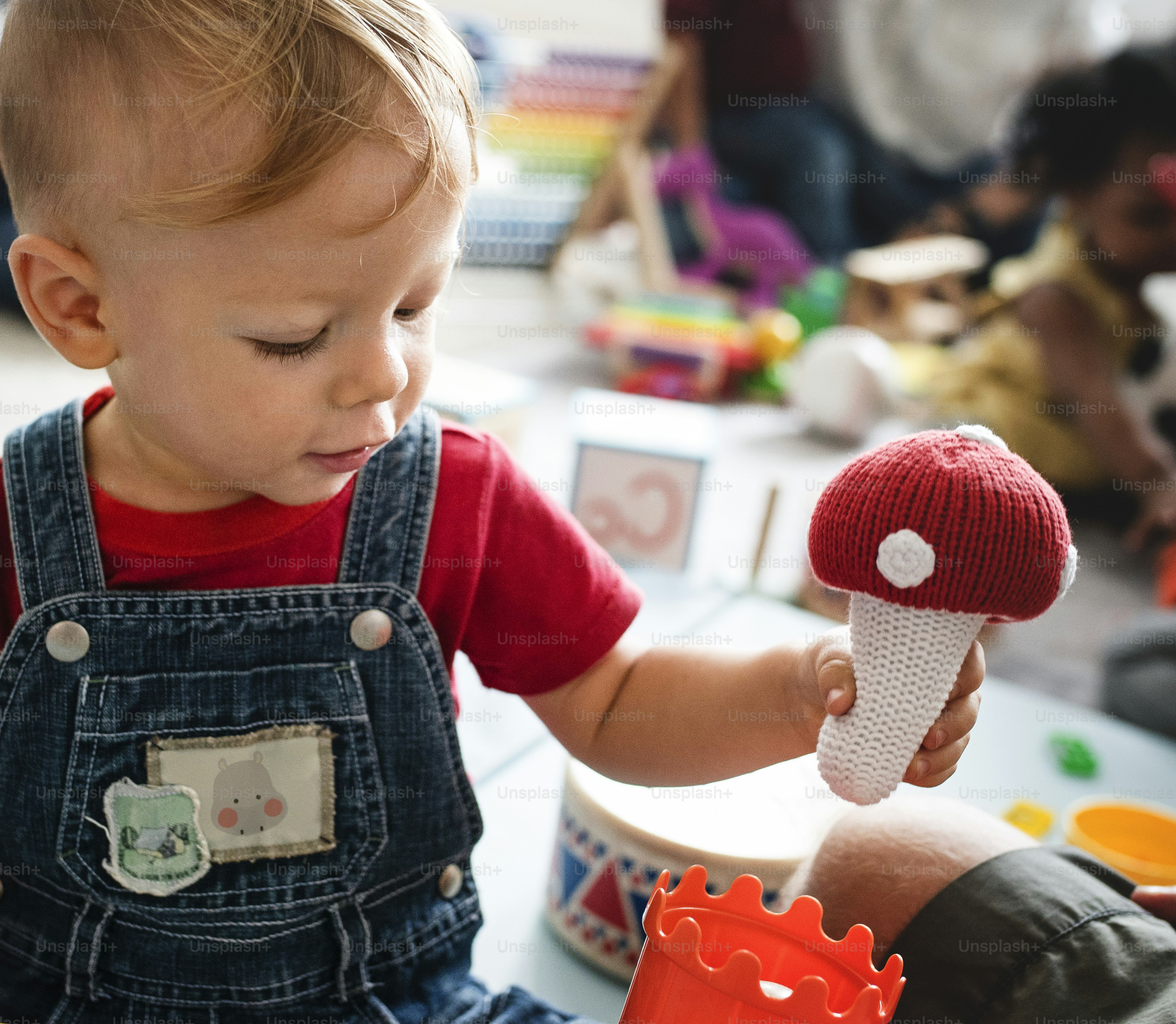 Cute little boy playing with toys at the learning center