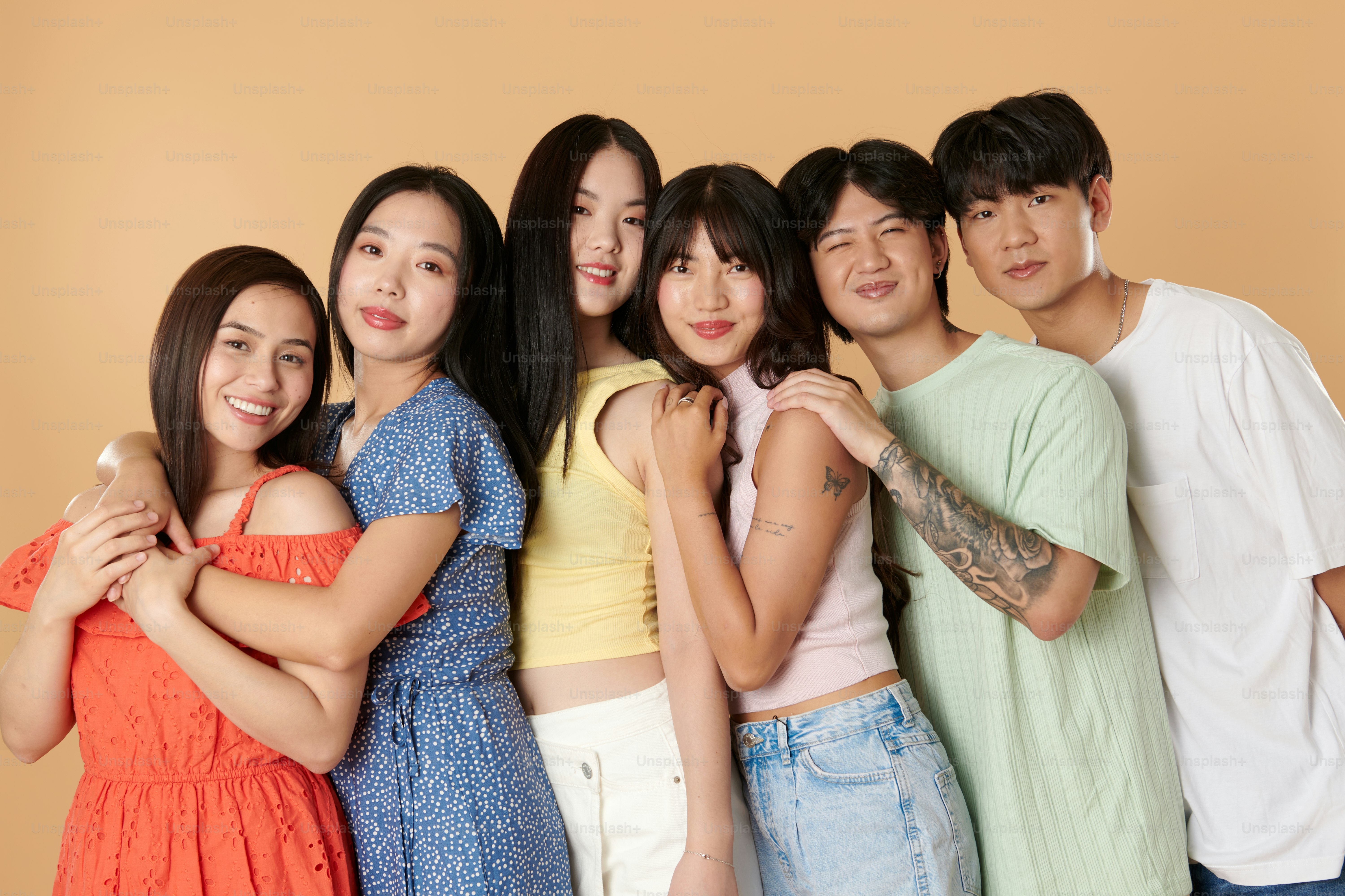 A group of young people standing next to each other