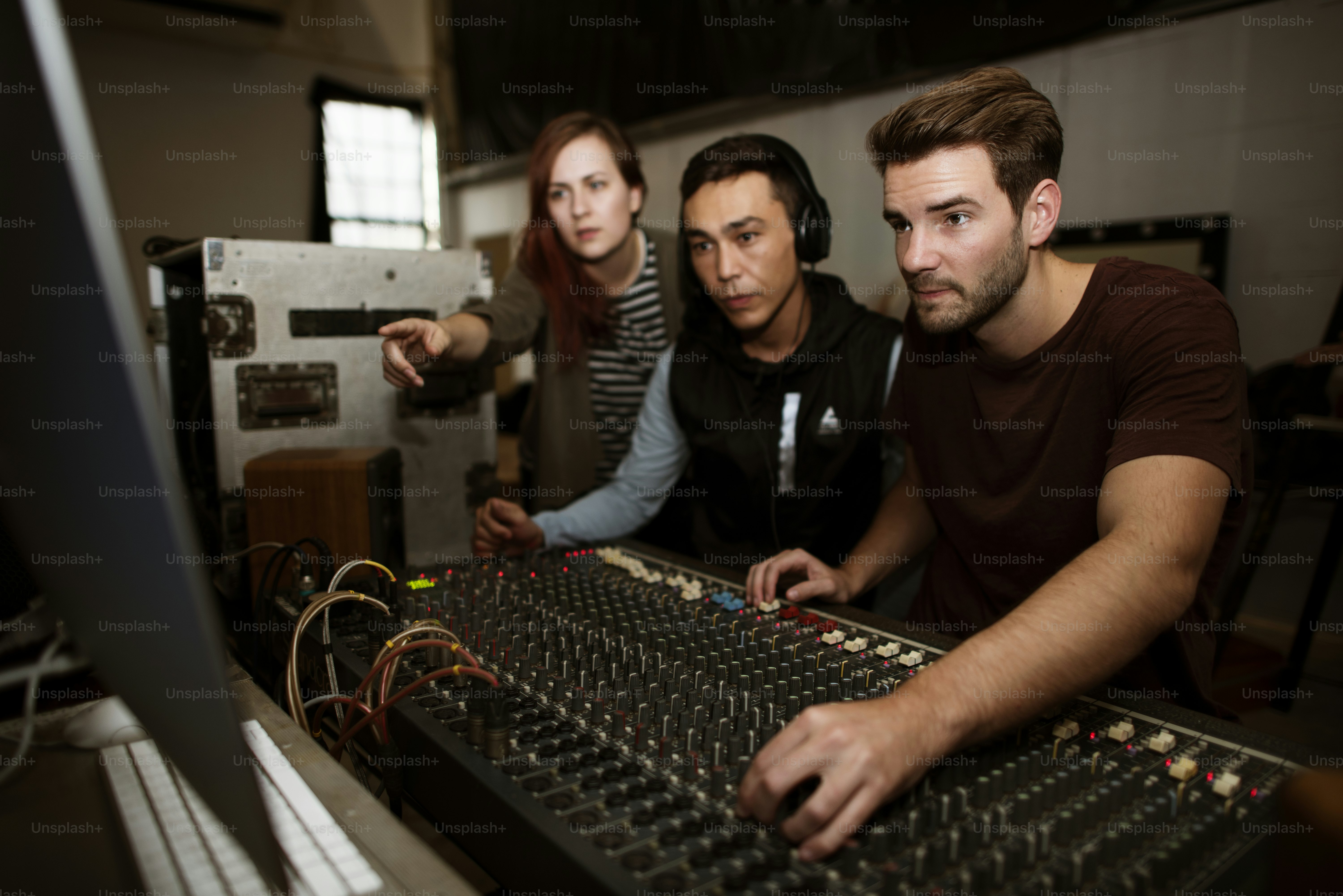 Sound engineer team check a sound on mixer