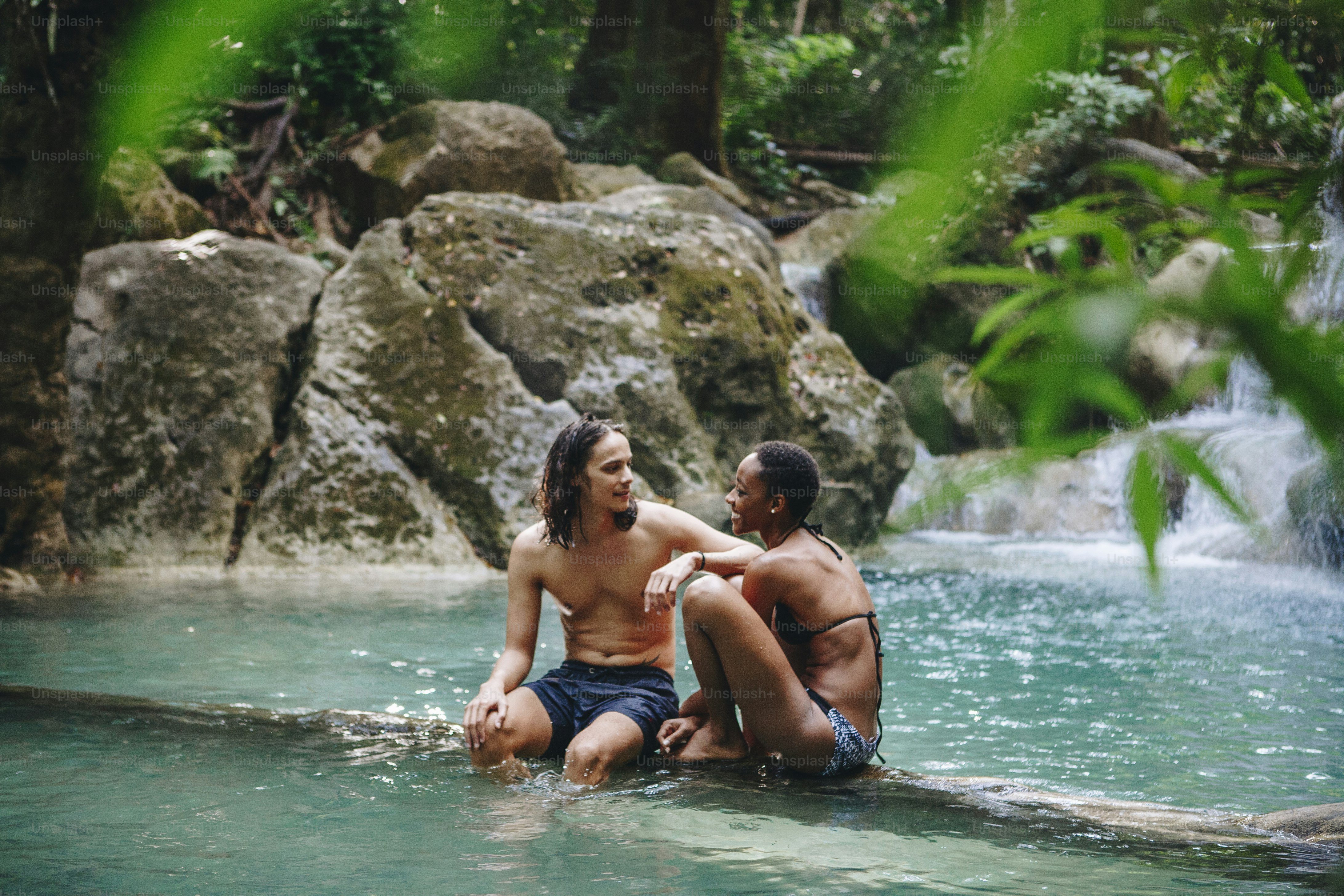 Couple enjoying the waterfall