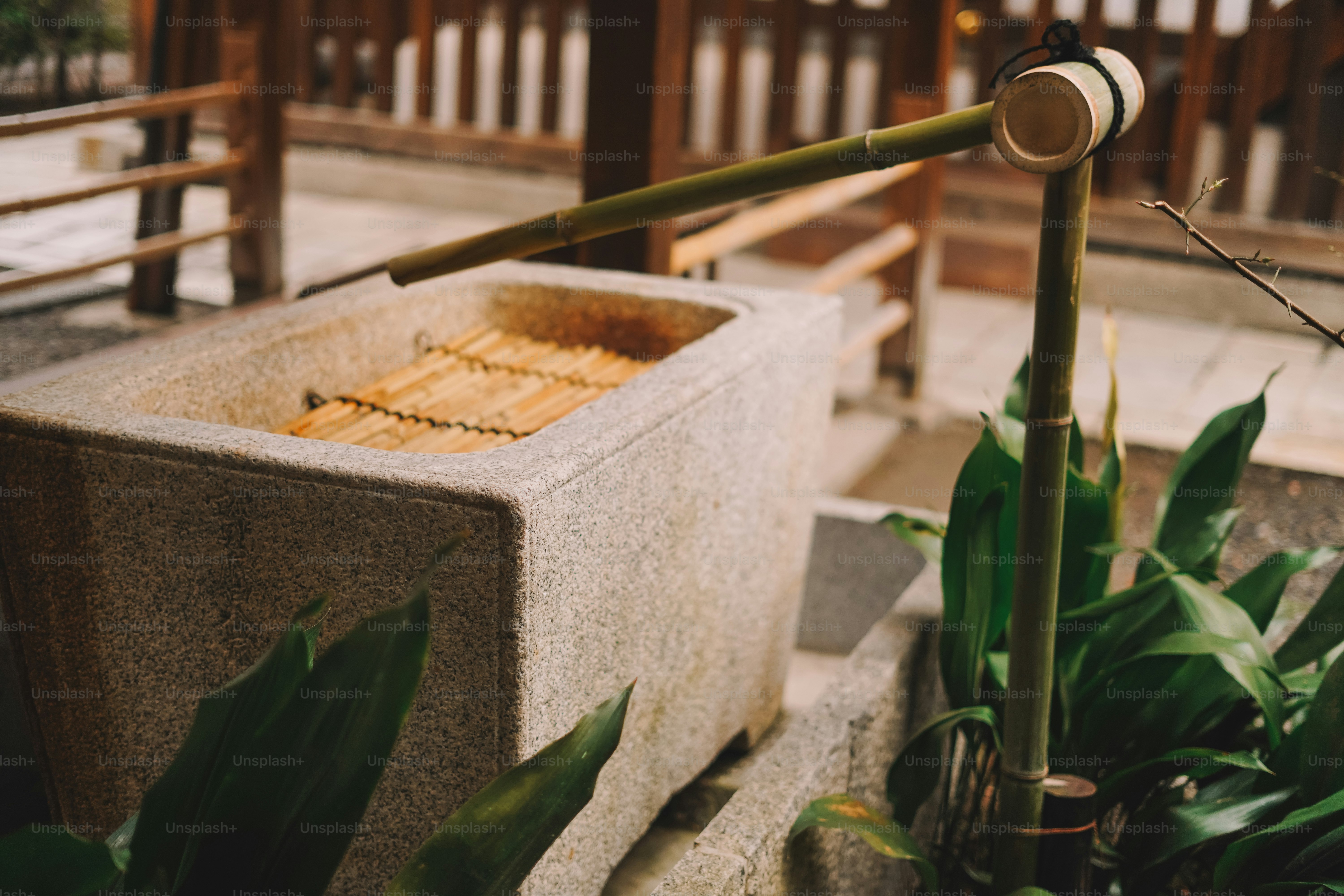 A stone box with a bamboo stick sticking out of it