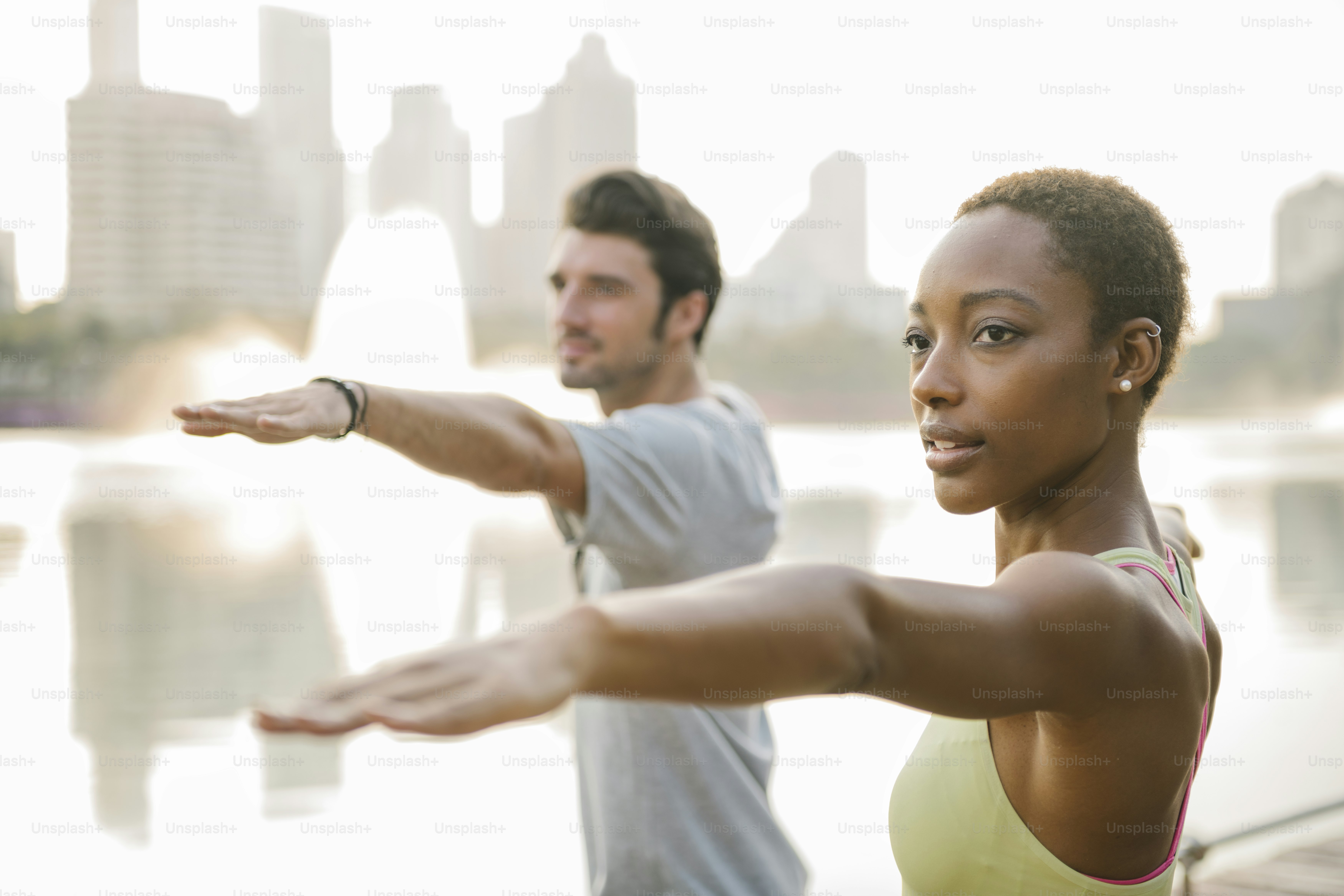 Couple doing a yoga in a park