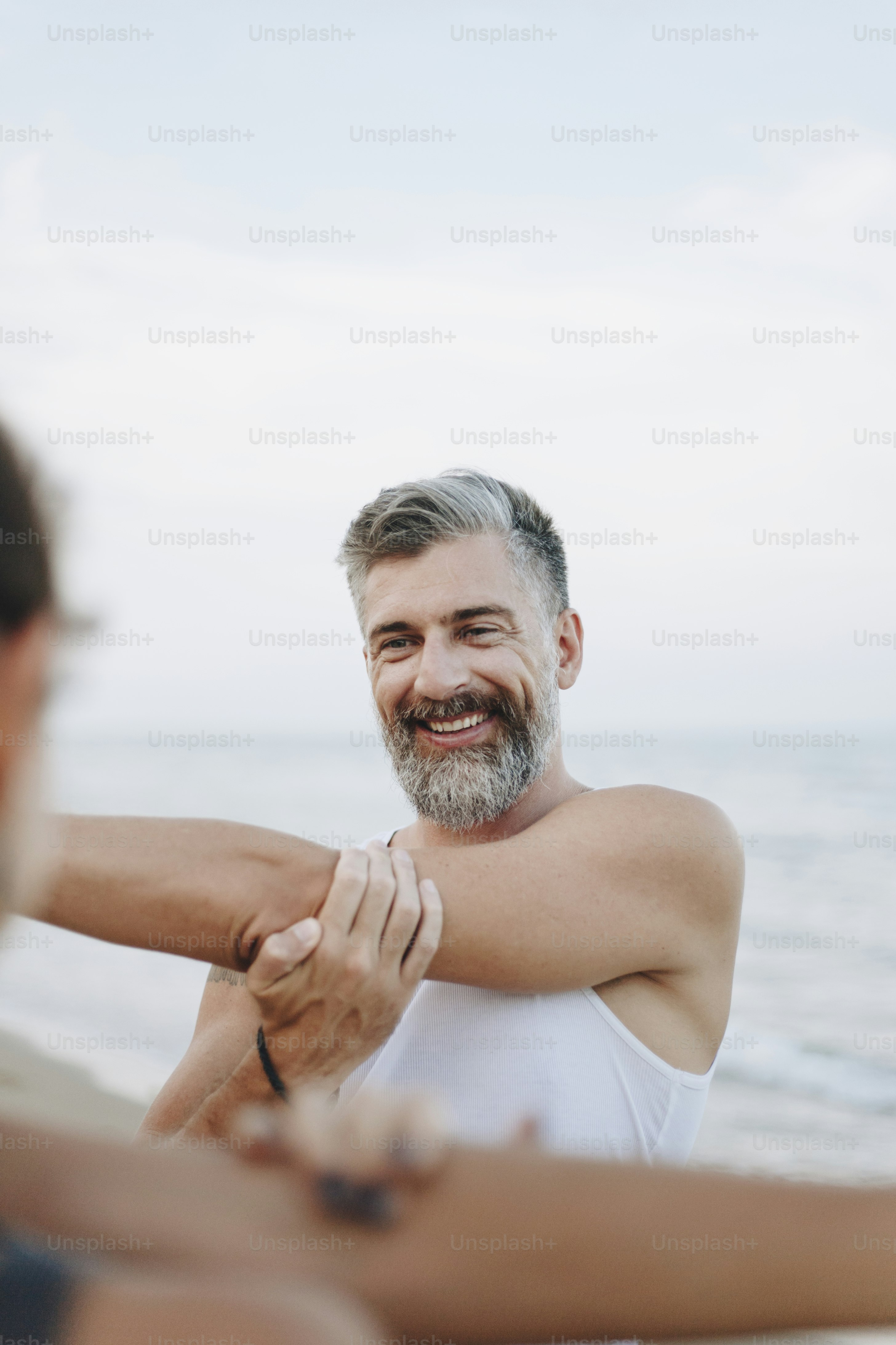 Couple stretching at the beach