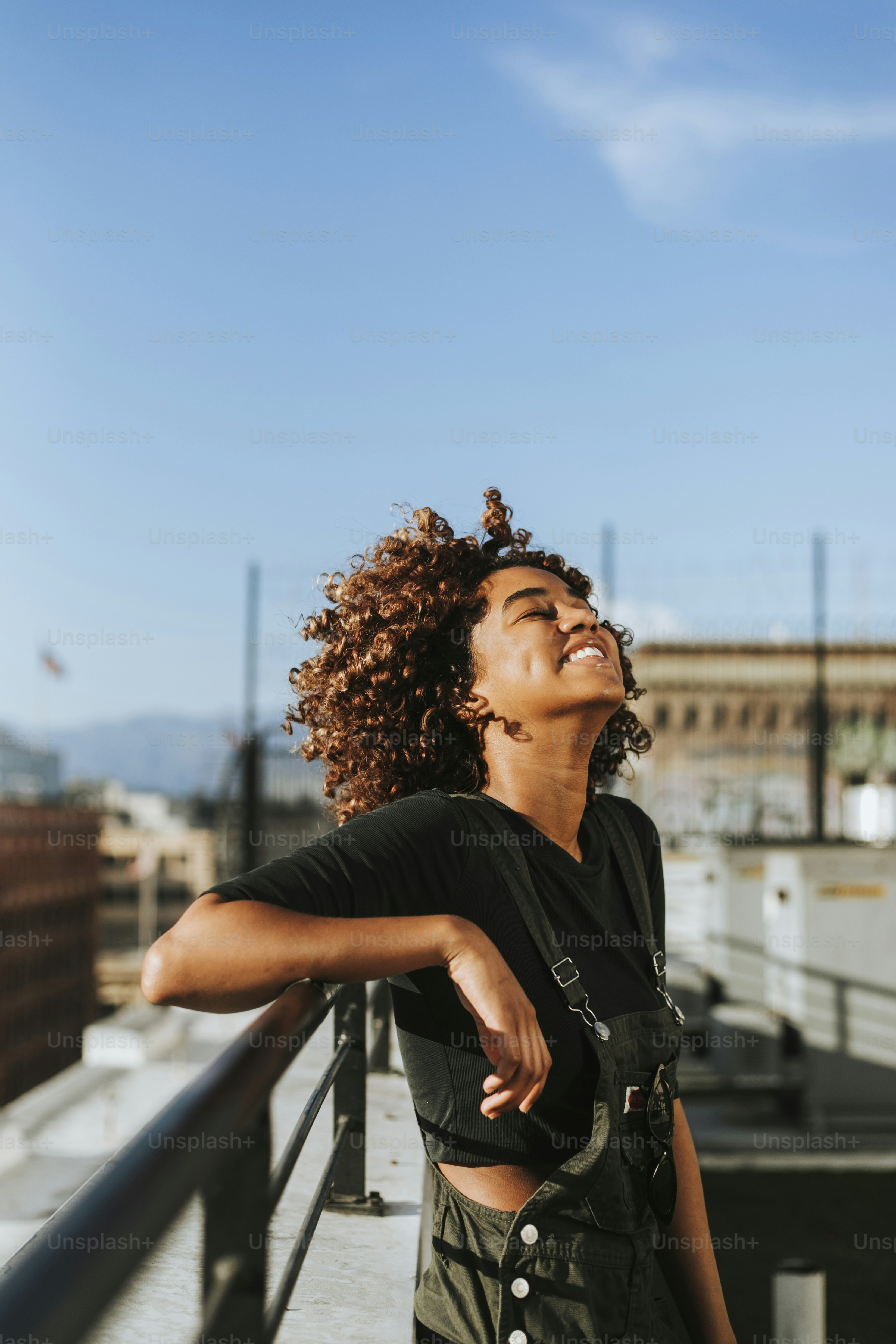 Girl with curly hair at a LA rooftop