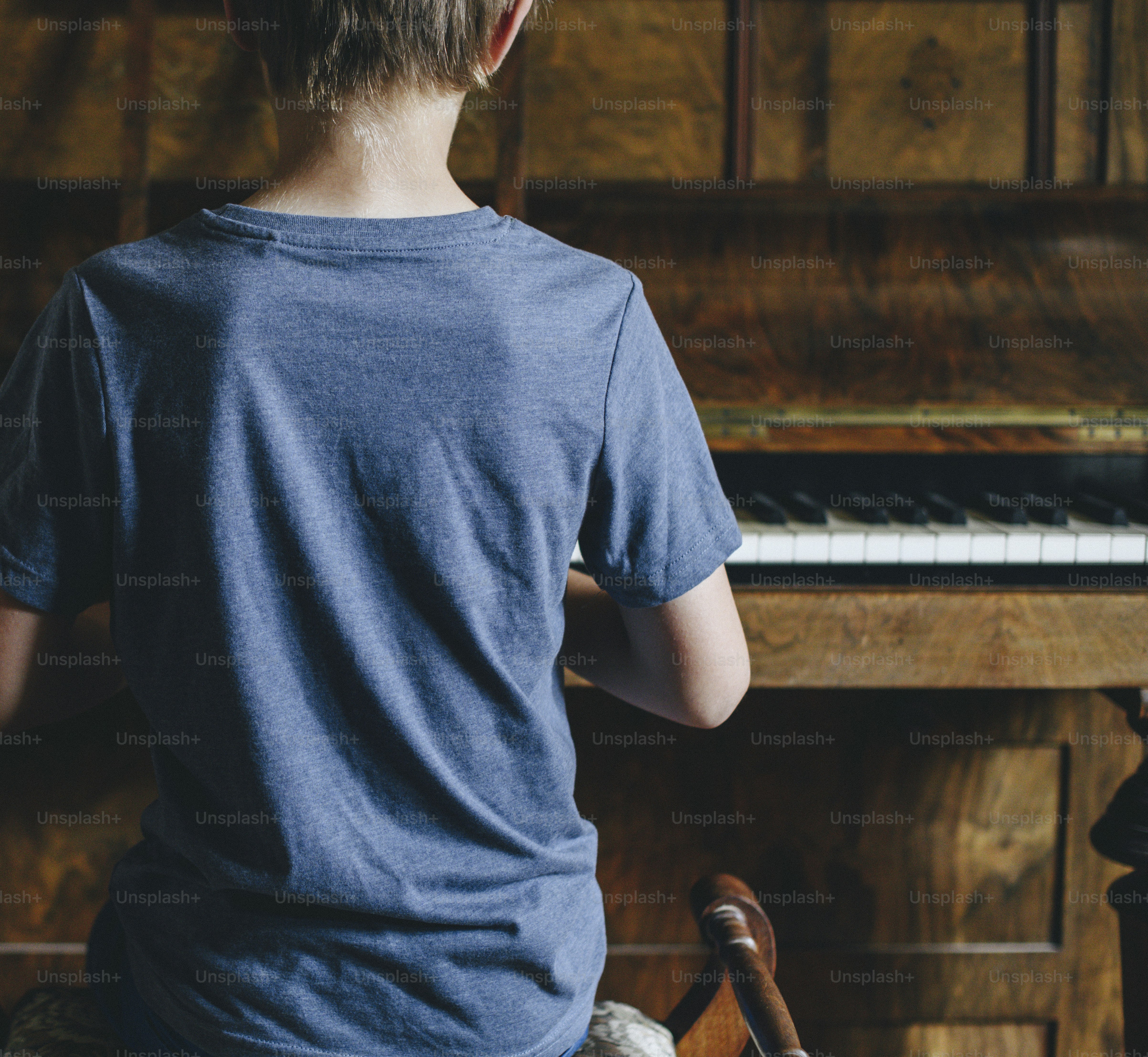Young boy playing the piano