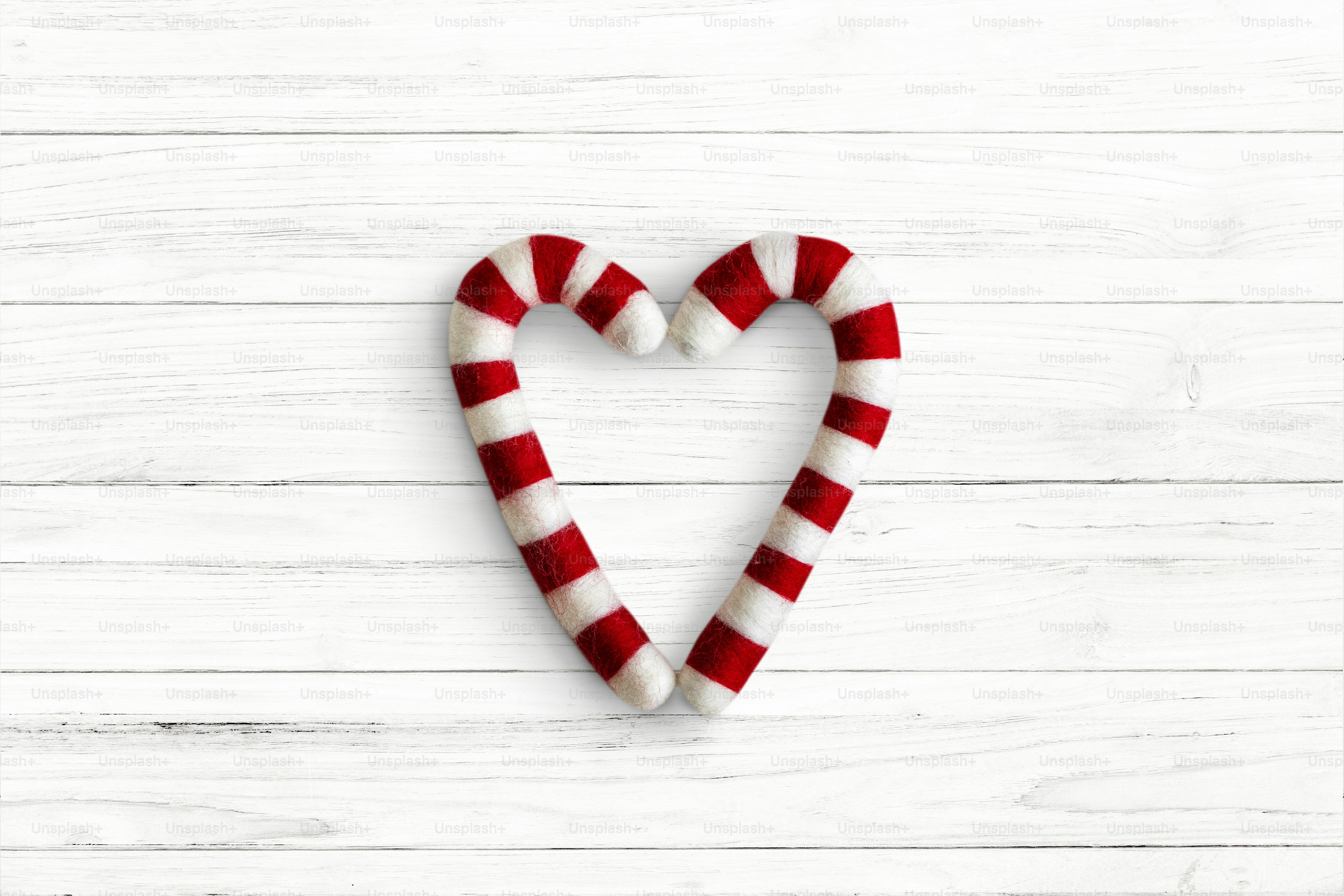 Heart shape candy cane sweets flatlay