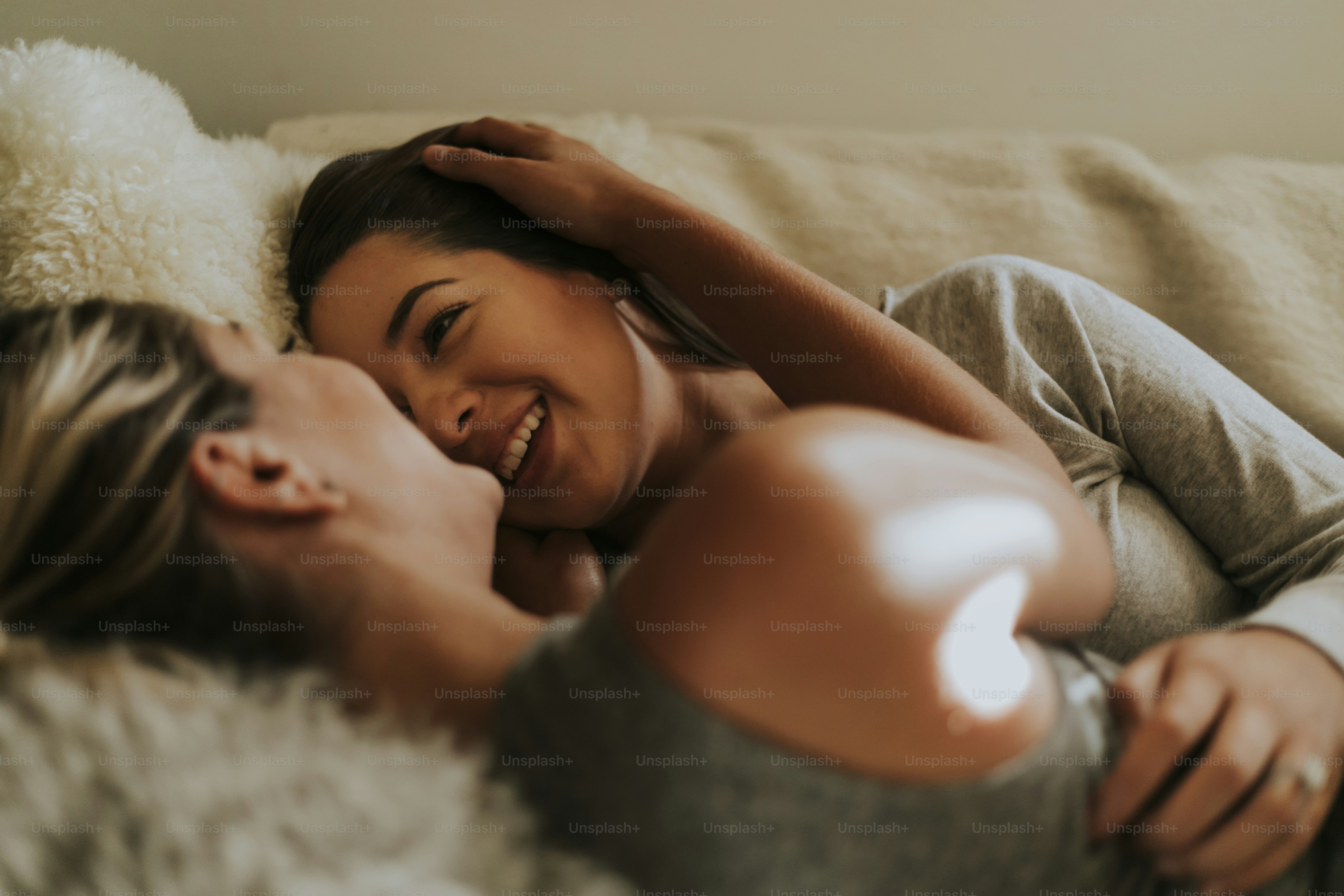 Lesbian couple together in bed