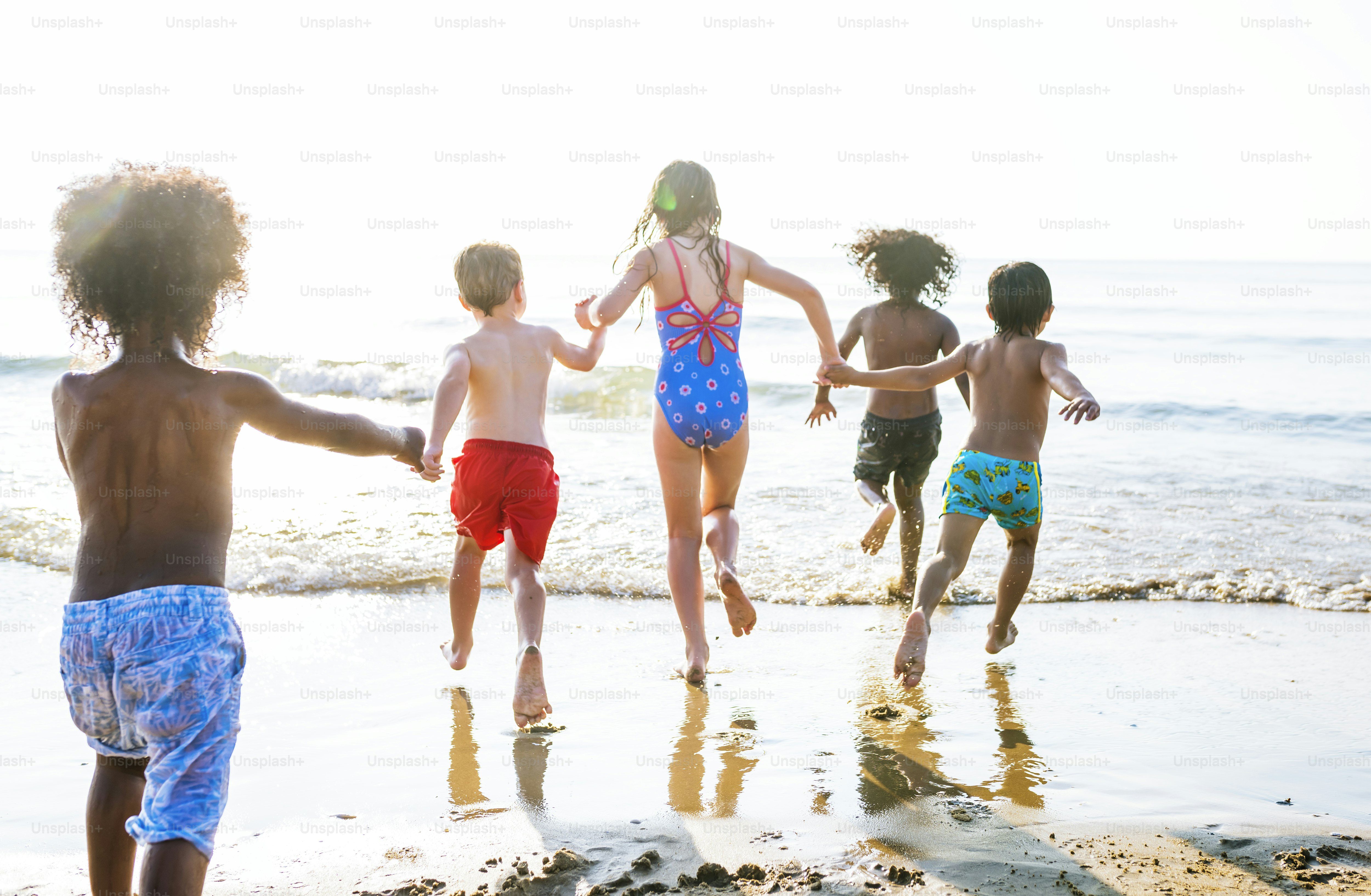 Kids running at the beach