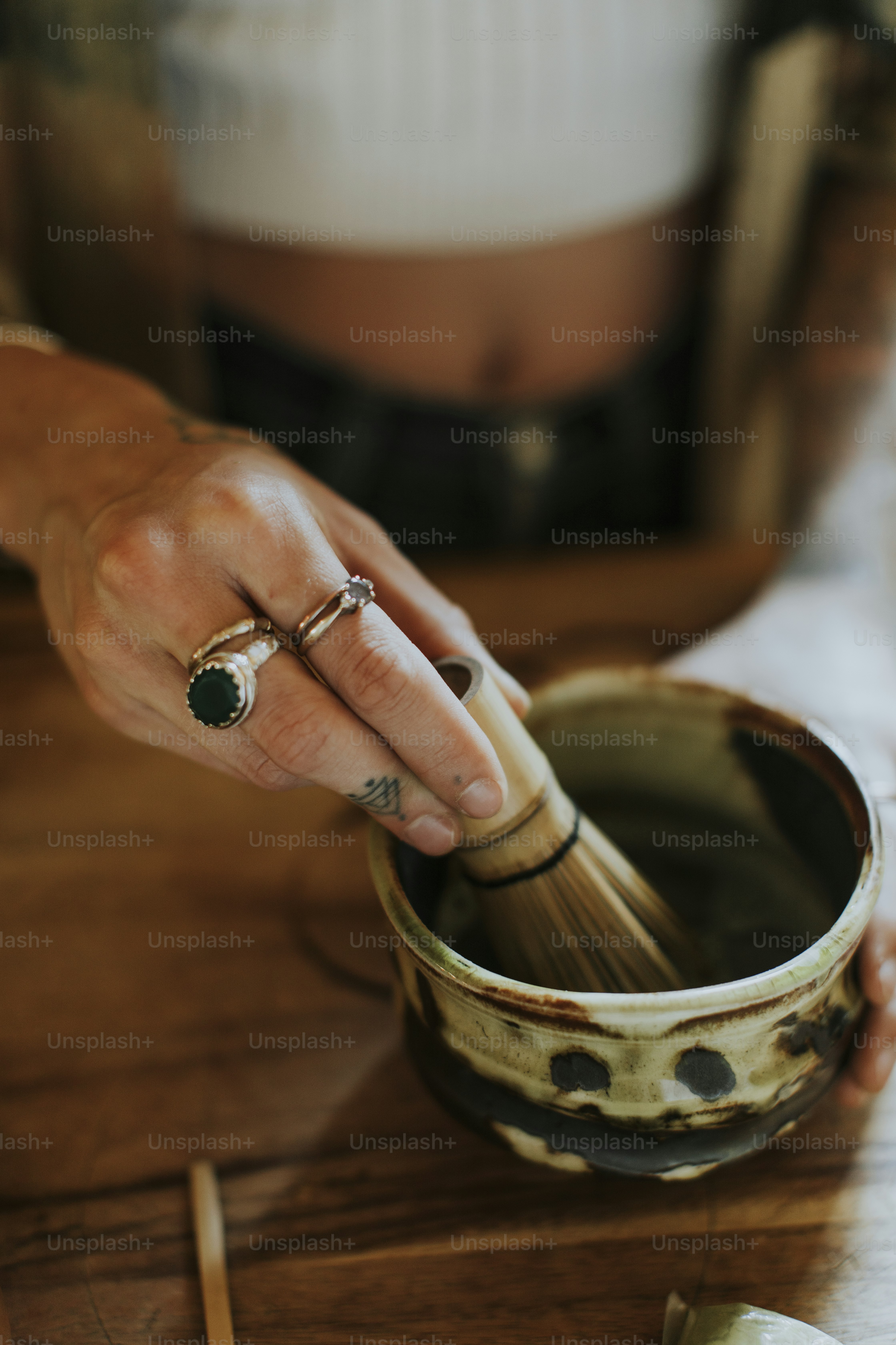 Woman preparing Japanese Matcha tea