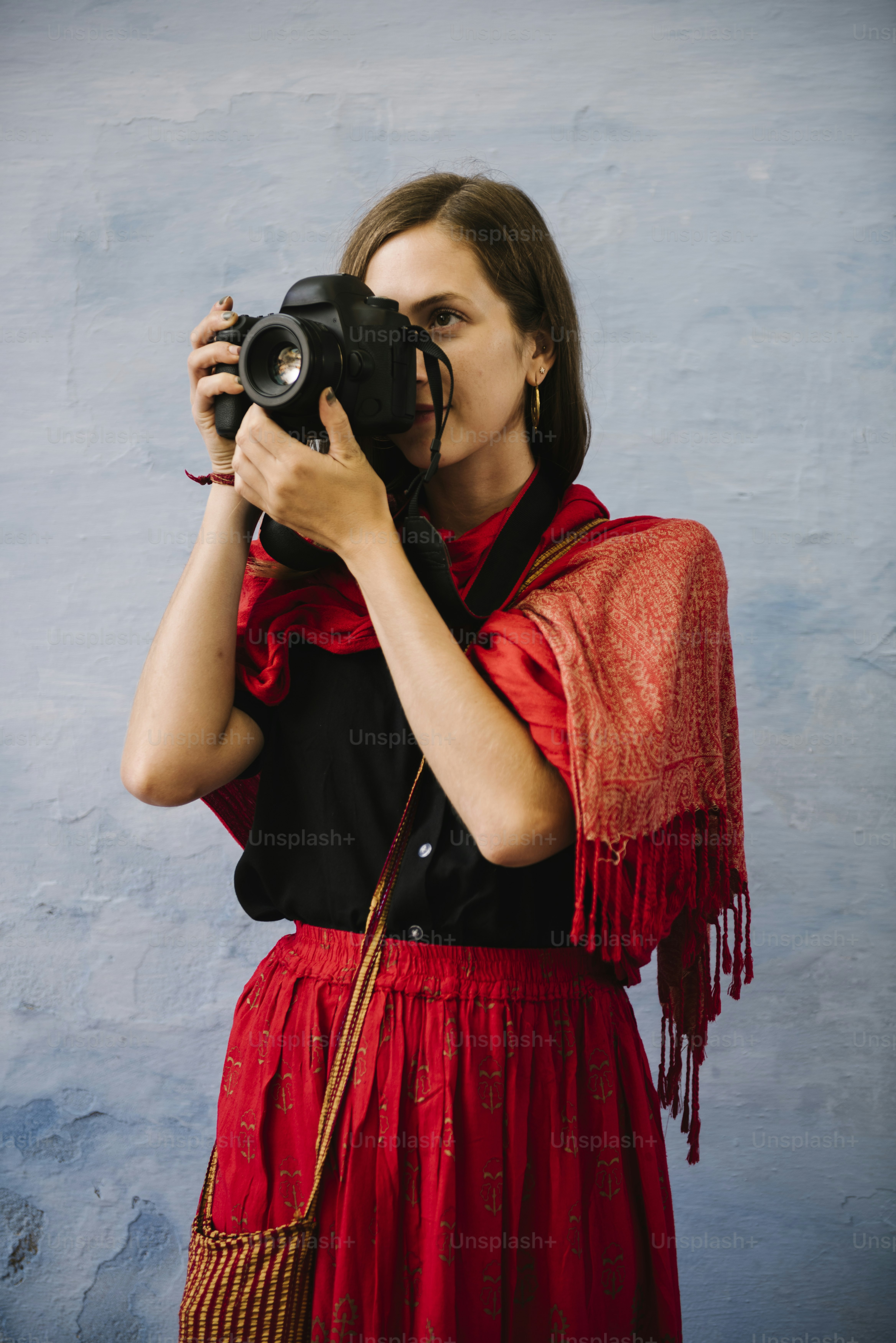 Western female photographer exploring a city of Udaipur, India